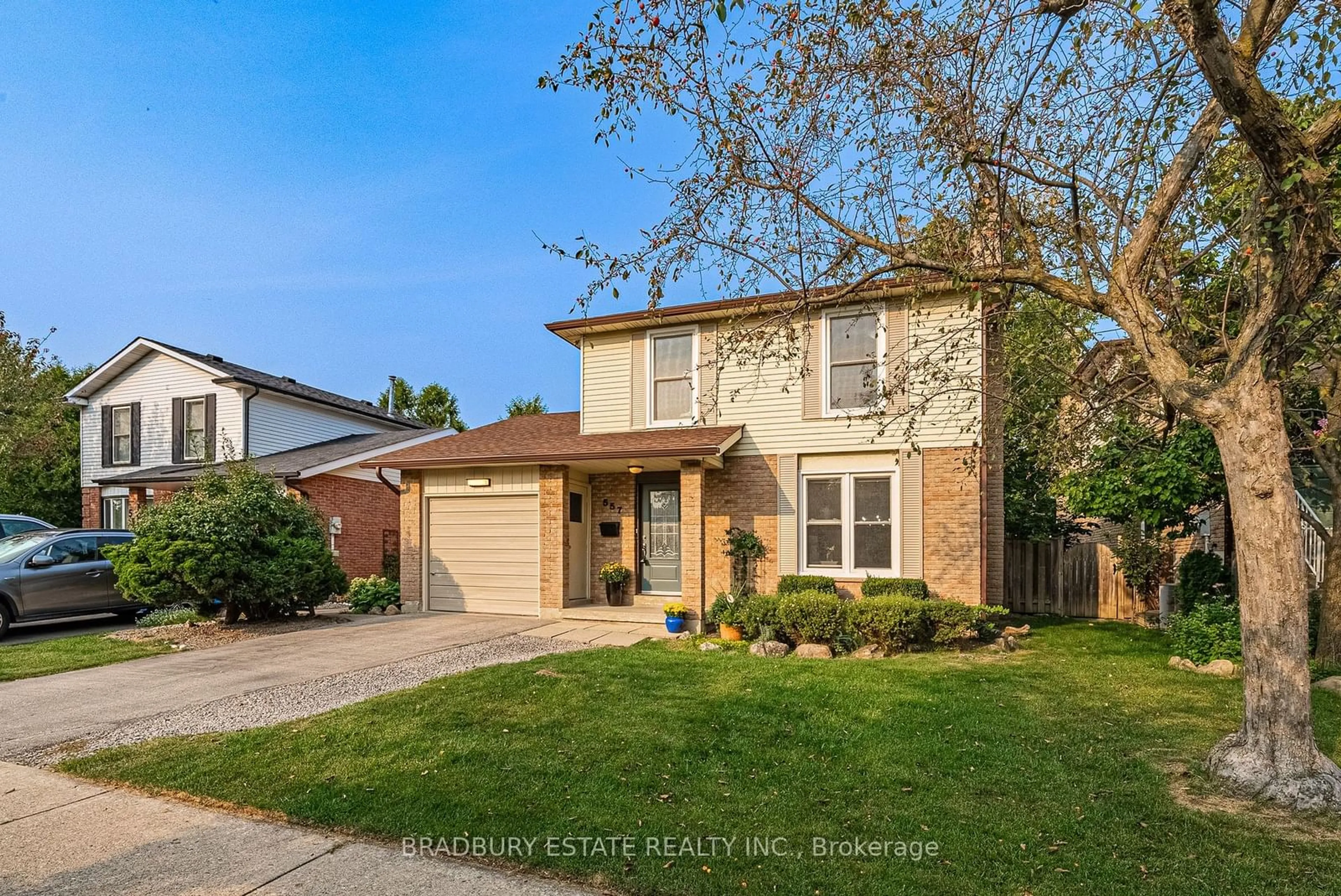 Frontside or backside of a home, the fenced backyard for 557 Holly Ave, Milton Ontario L9T 4L9