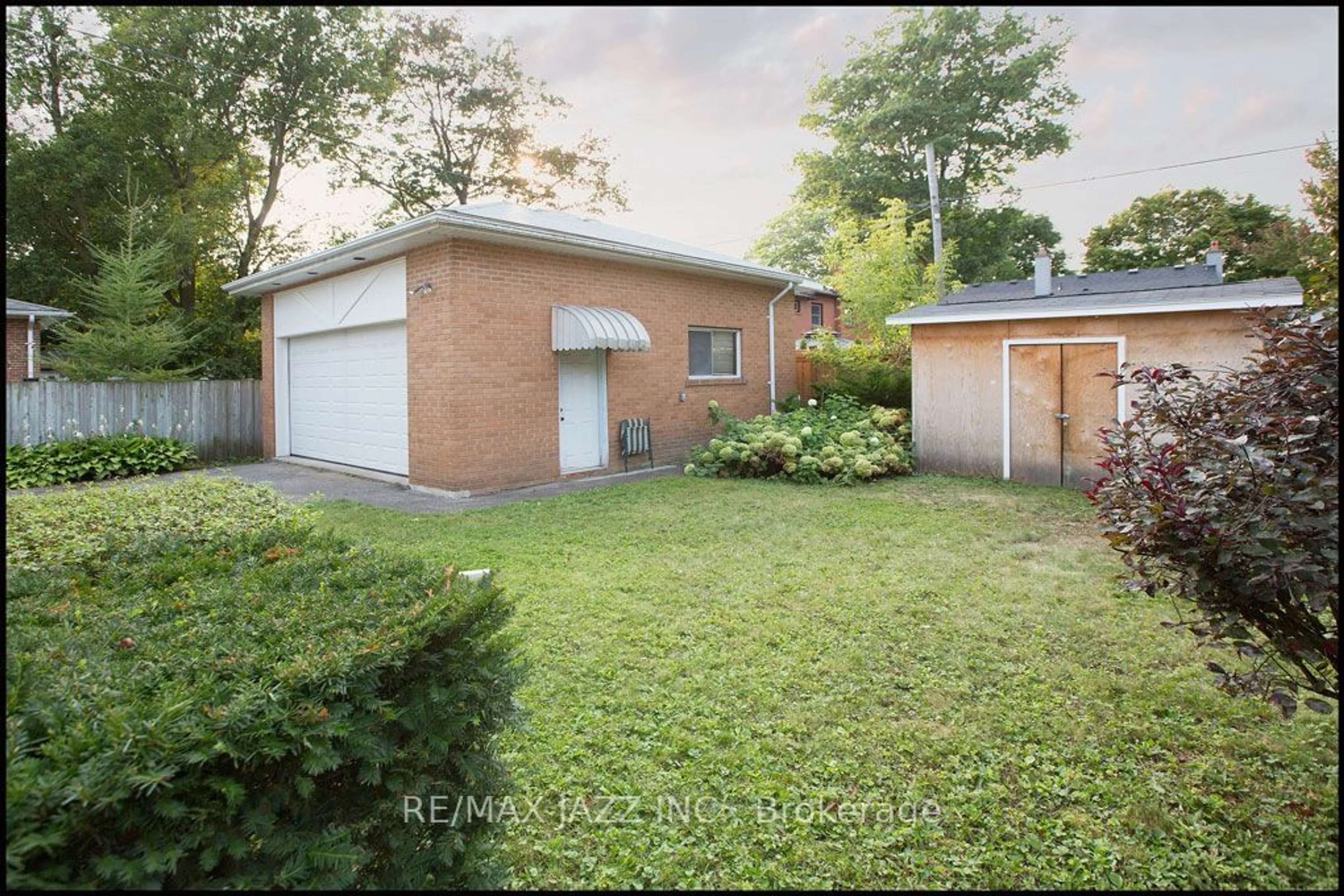 Frontside or backside of a home, the fenced backyard for 251 Troy St, Mississauga Ontario L5G 1S9