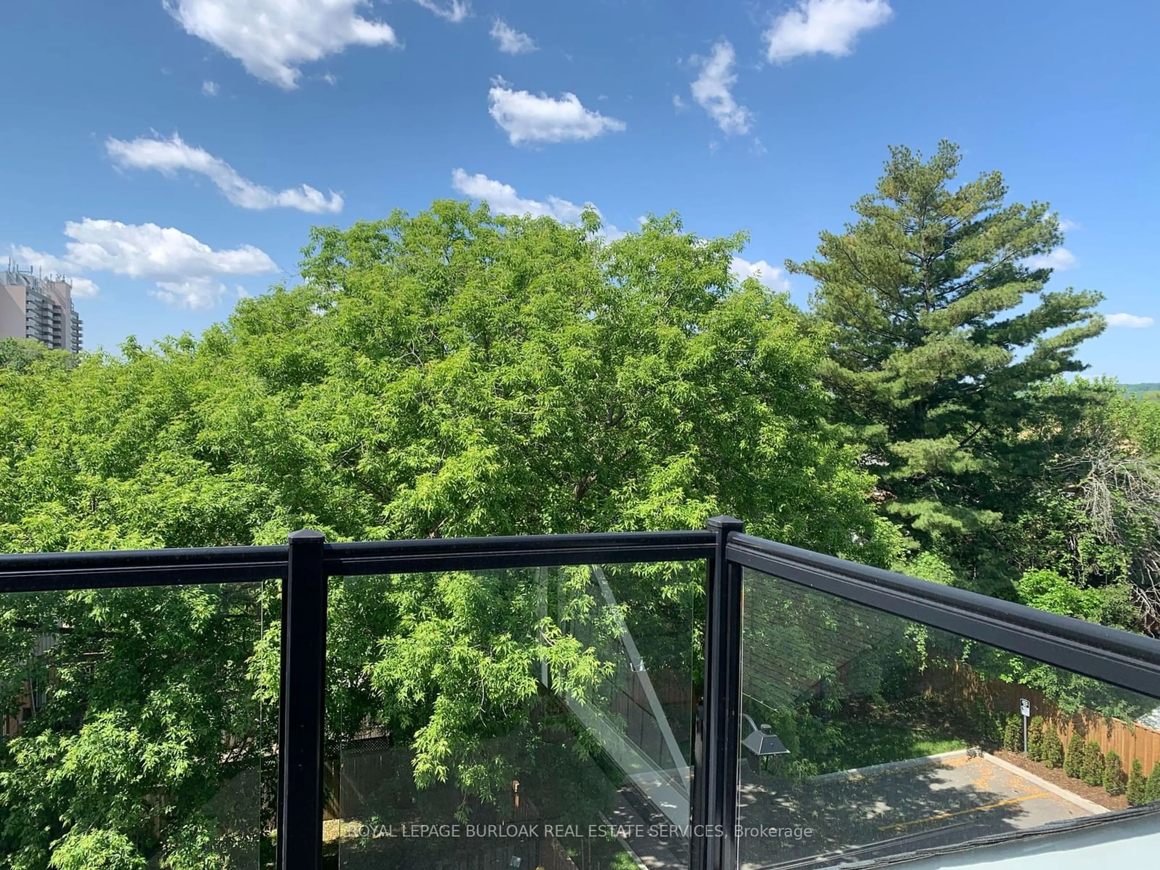 A pic from outside/outdoor area/front of a property/back of a property/a pic from drone, forest/trees view for 2071 Ghent Ave #3, Burlington Ontario L7R 1Y4