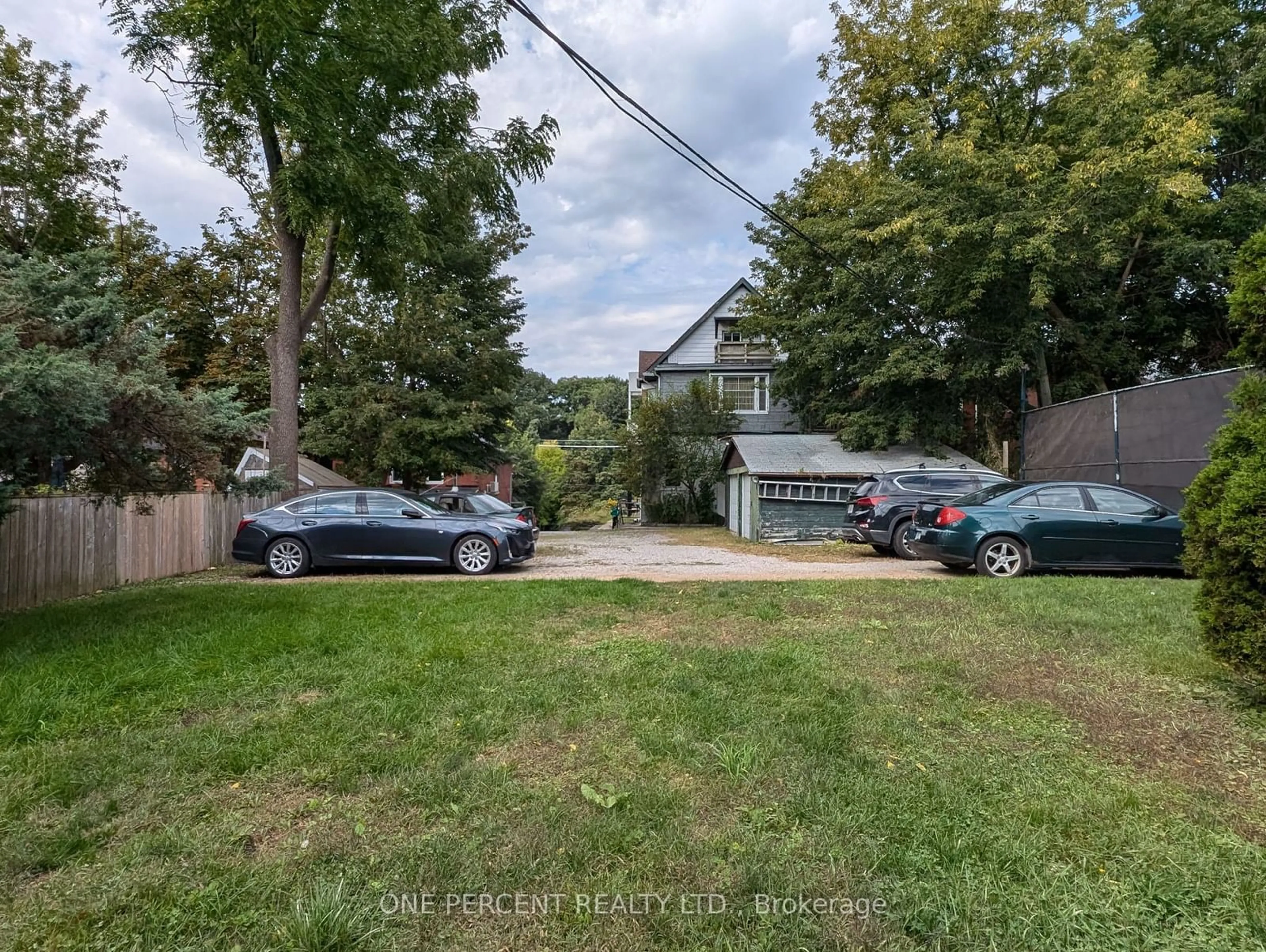 Frontside or backside of a home, the street view for 115 Parkside Dr, Toronto Ontario M6R 2Y8