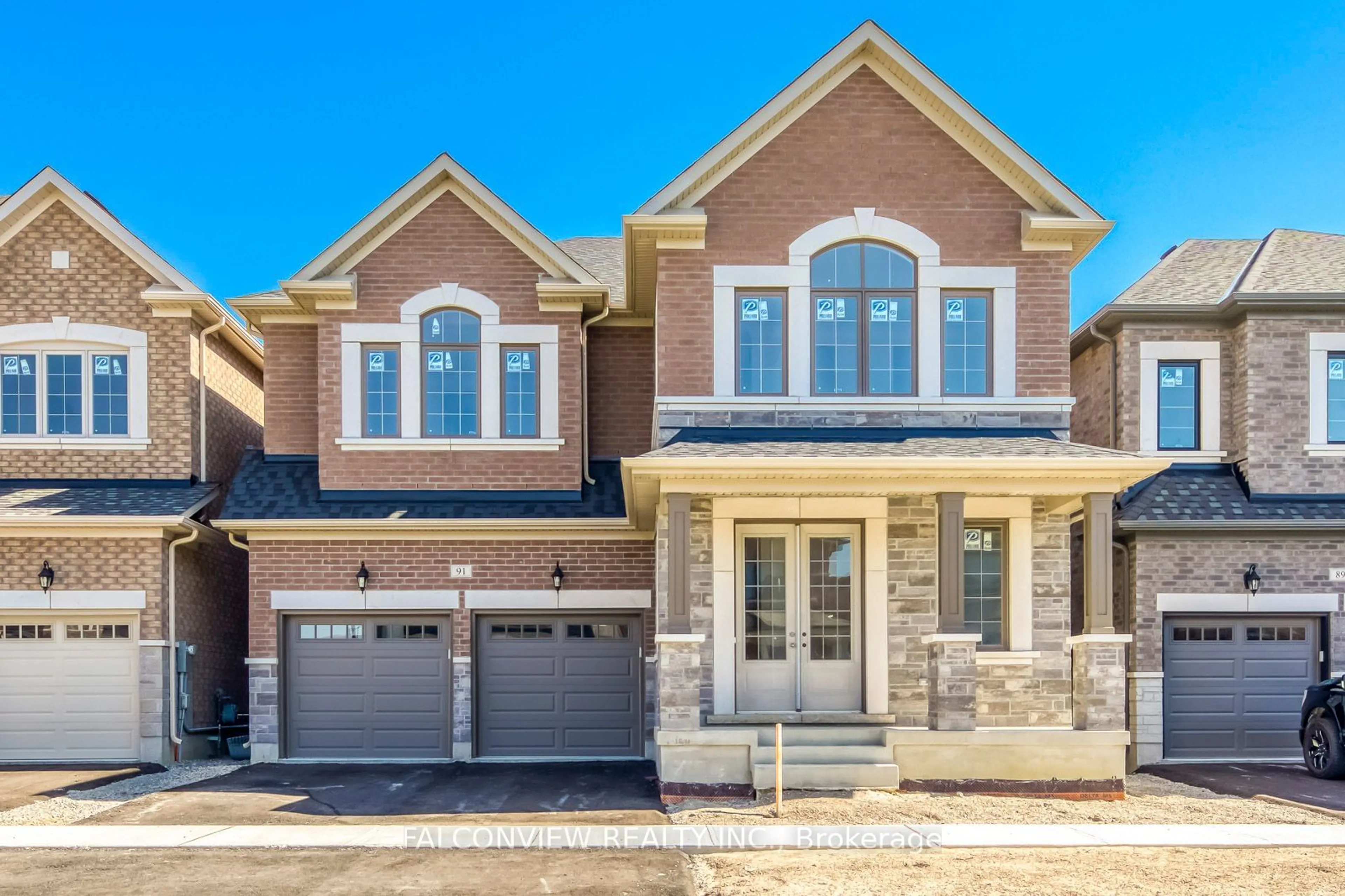 Home with brick exterior material, street for 91 BRENSCOMBE Rd, Brampton Ontario L7A 4K5