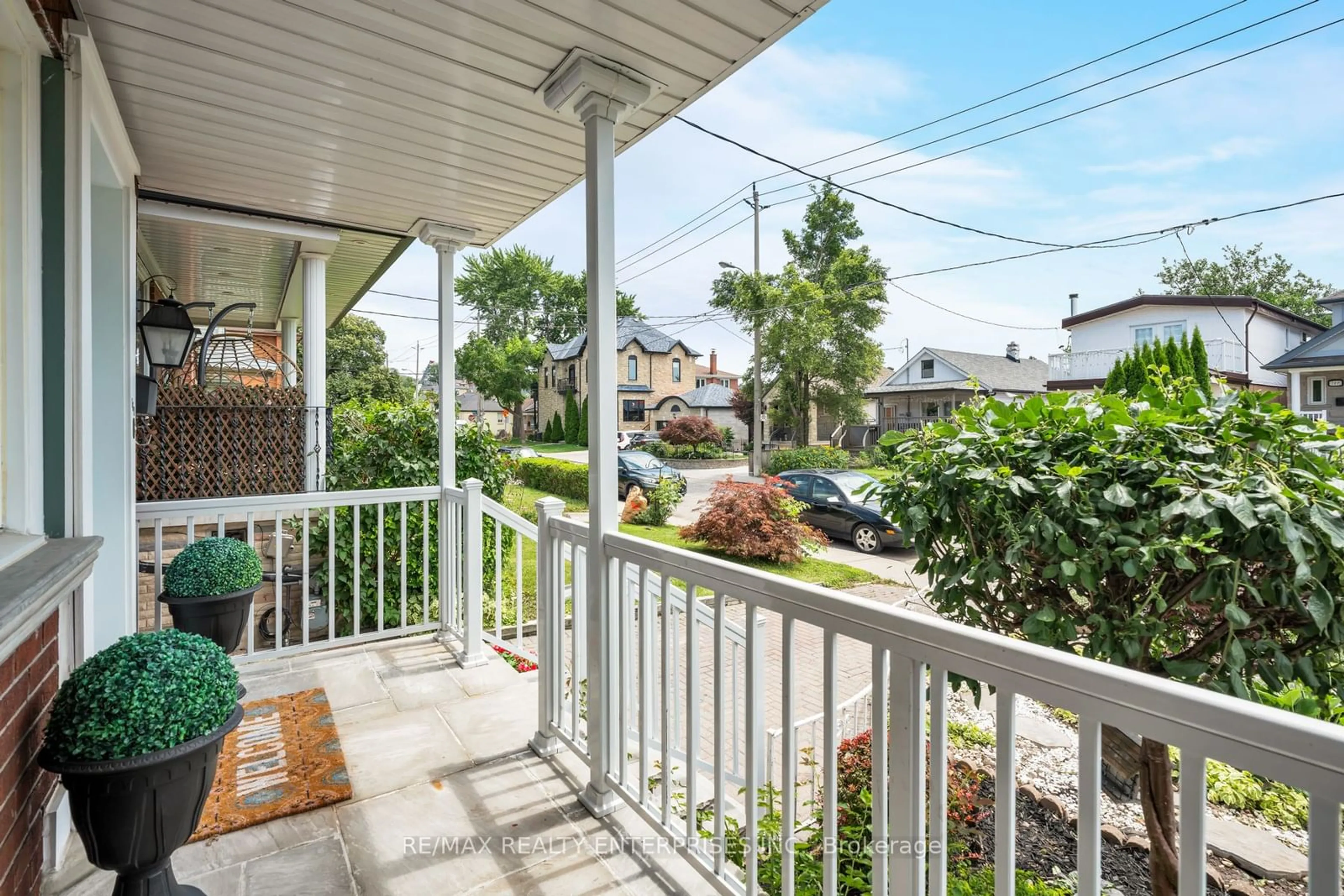 A pic from exterior of the house or condo, the fenced backyard for 168 Dunraven Dr, Toronto Ontario M6M 1H5