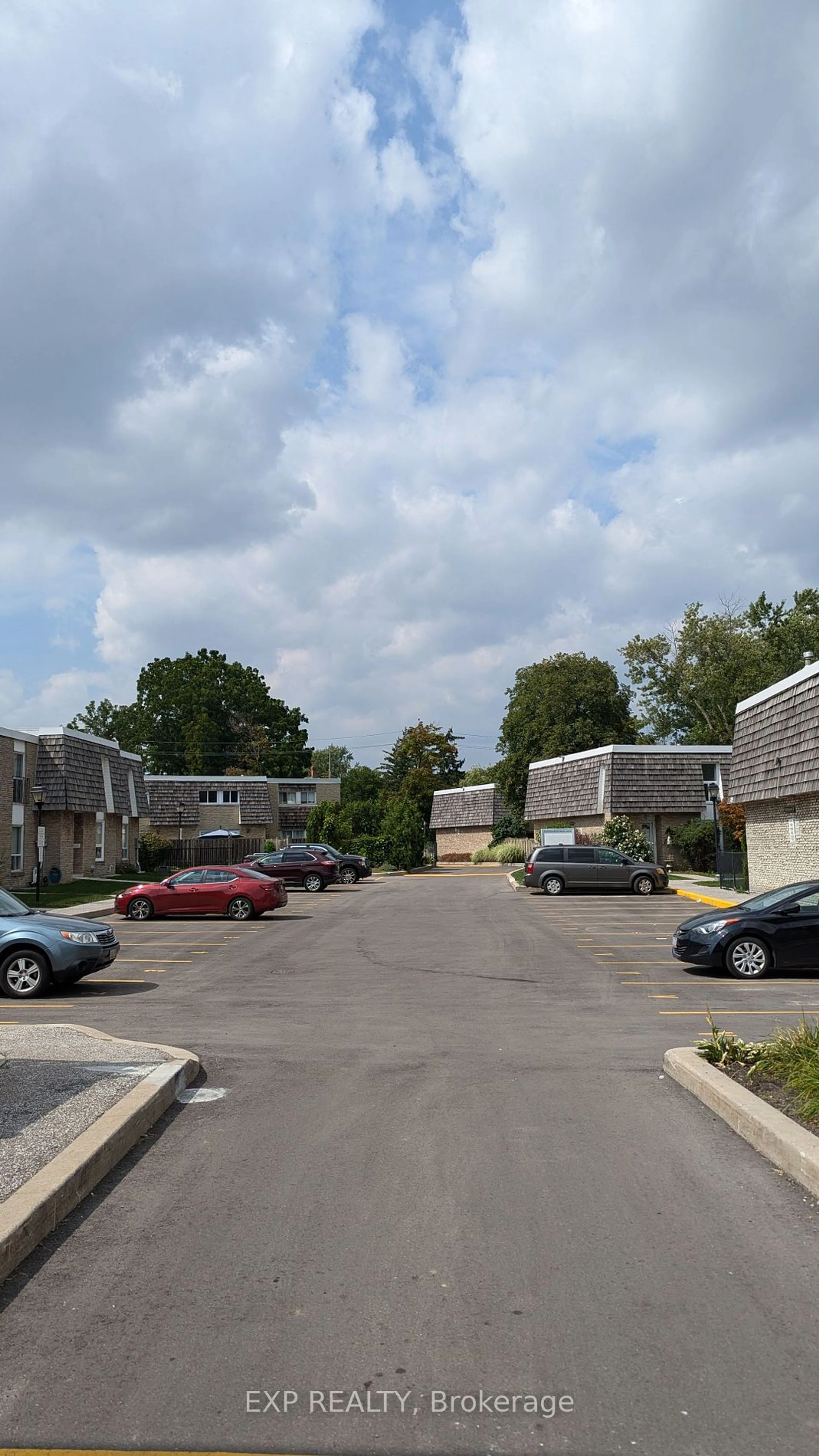 A pic from exterior of the house or condo, the street view for 701 Burnhamthorpe Rd #106, Toronto Ontario M9C 2Z6