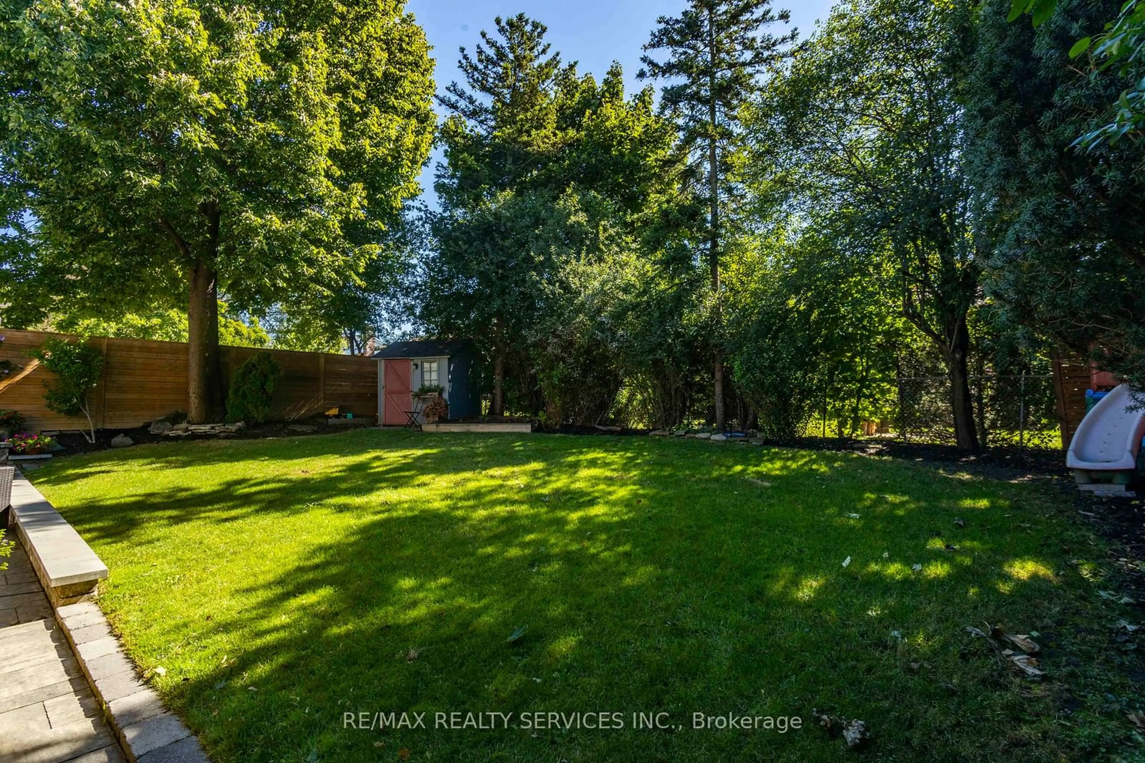 A pic from exterior of the house or condo, the fenced backyard for 18 Parkend Ave, Brampton Ontario L6Y 1B2