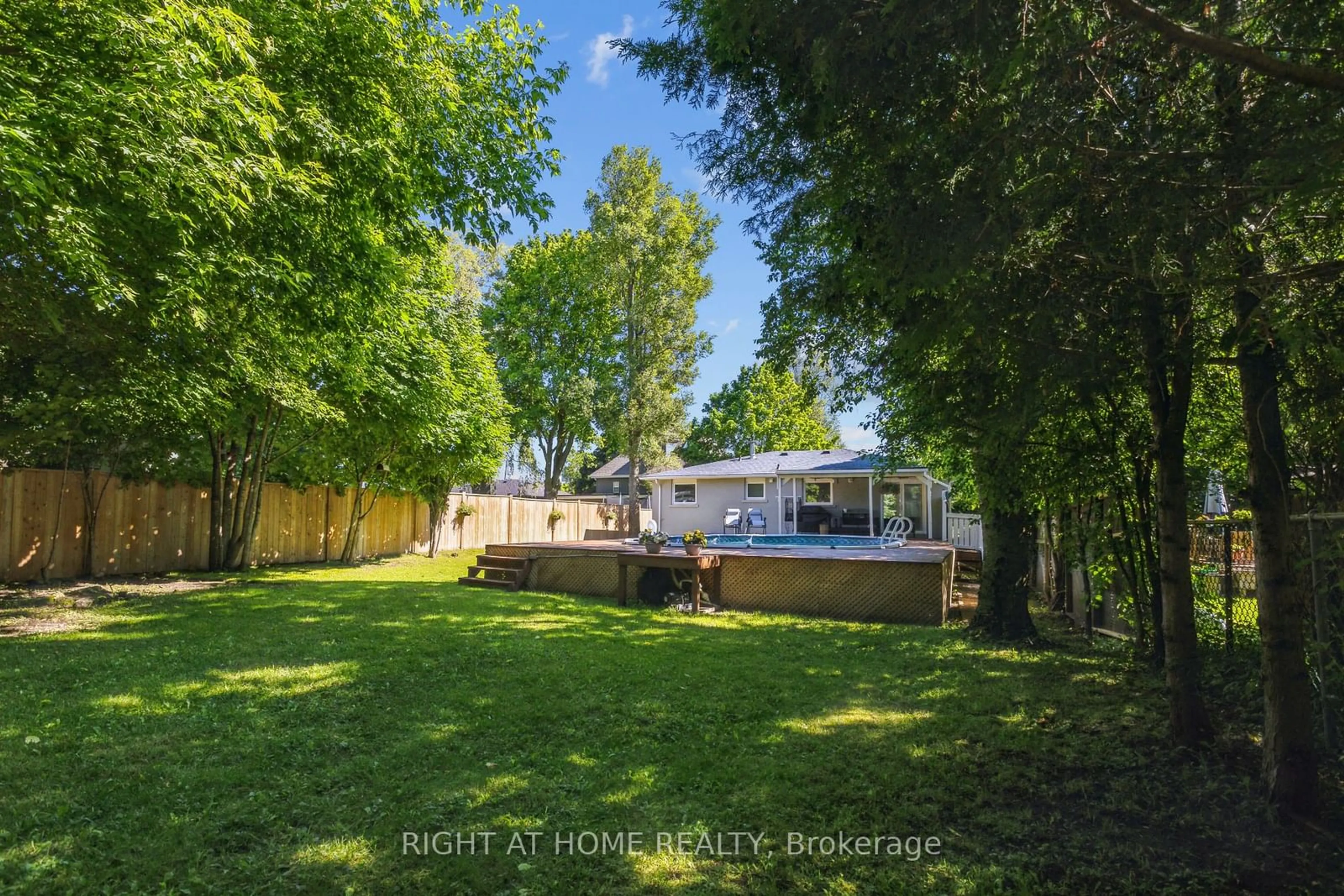 Frontside or backside of a home, the fenced backyard for 50 Bythia St, Orangeville Ontario L9W 2S3