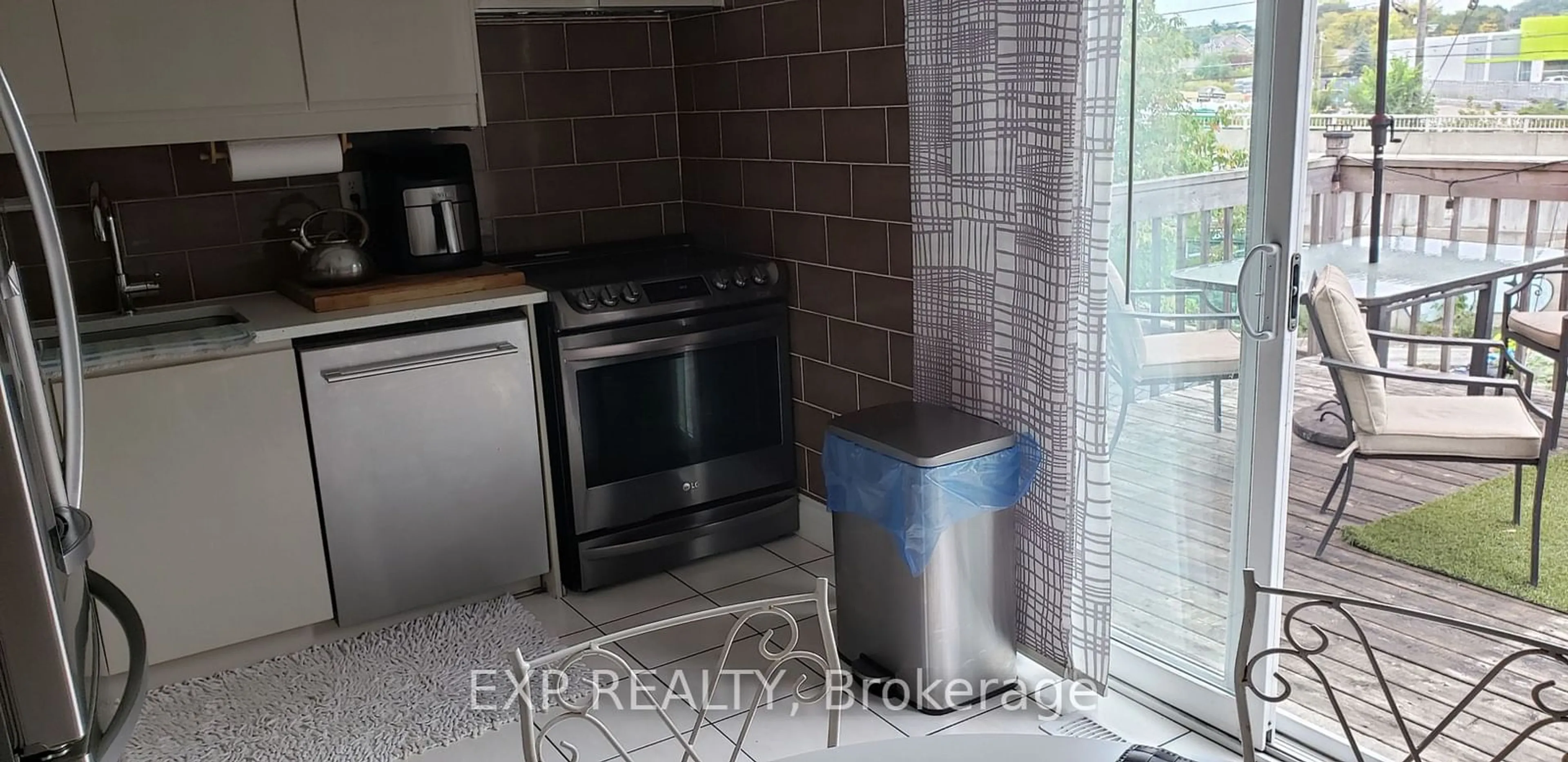 Kitchen with laundary machines, ceramic floors for 219 Touchstone Dr, Toronto Ontario M6M 5J9