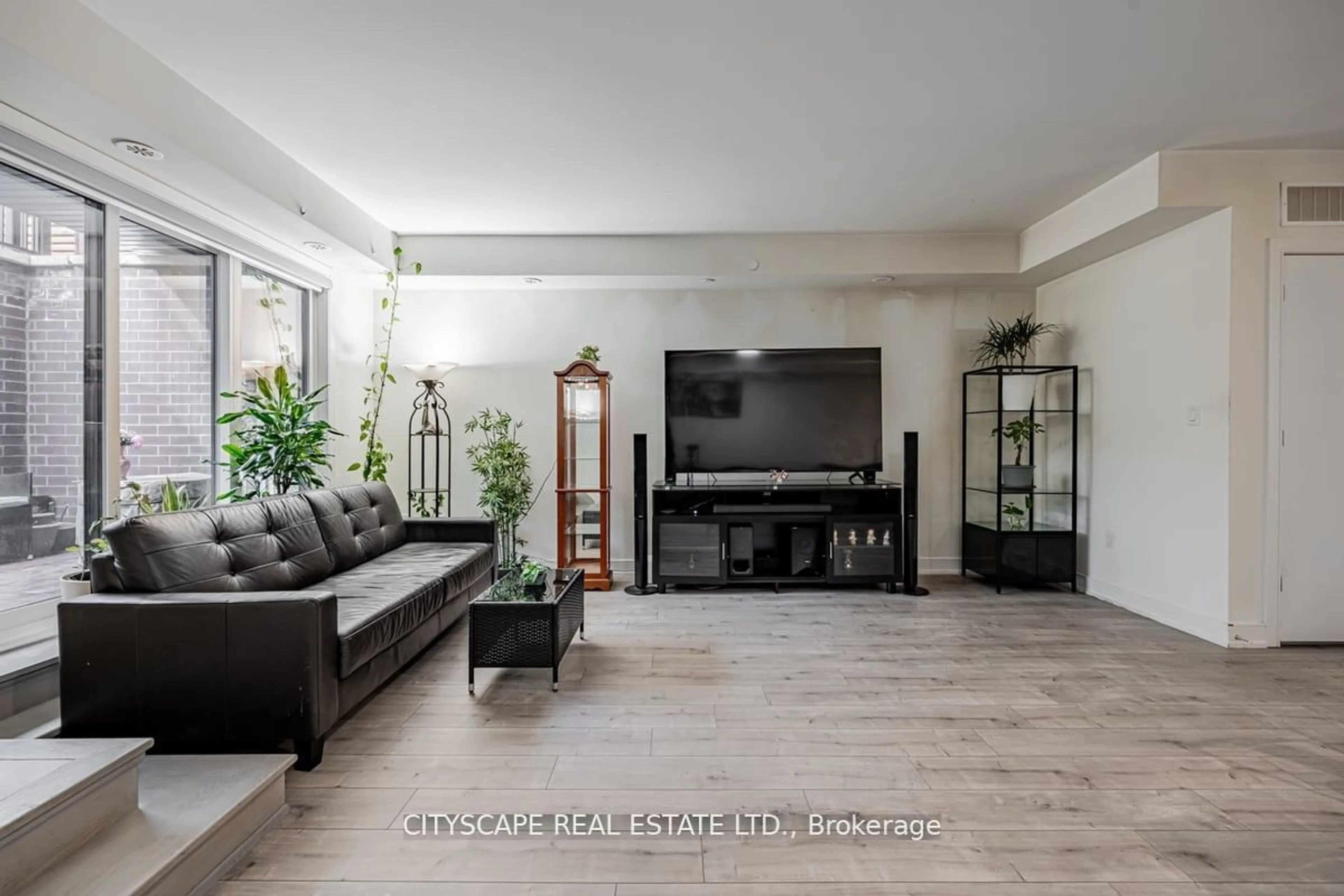 Living room, wood floors for 66 Longbranch Ave #1, Toronto Ontario M8W 3J4