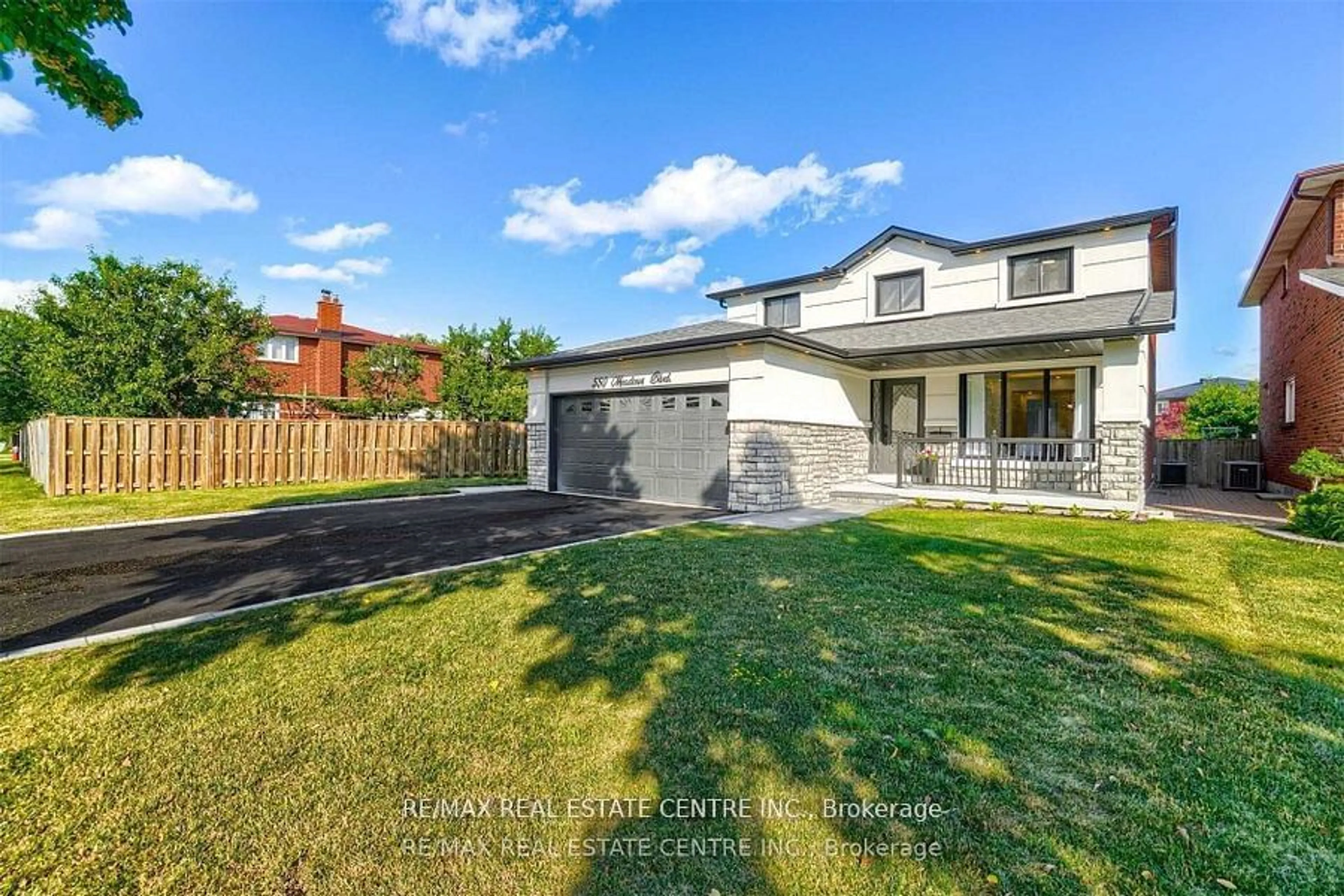 Frontside or backside of a home, the fenced backyard for 550 Meadows Blvd, Mississauga Ontario L4Z 1G6