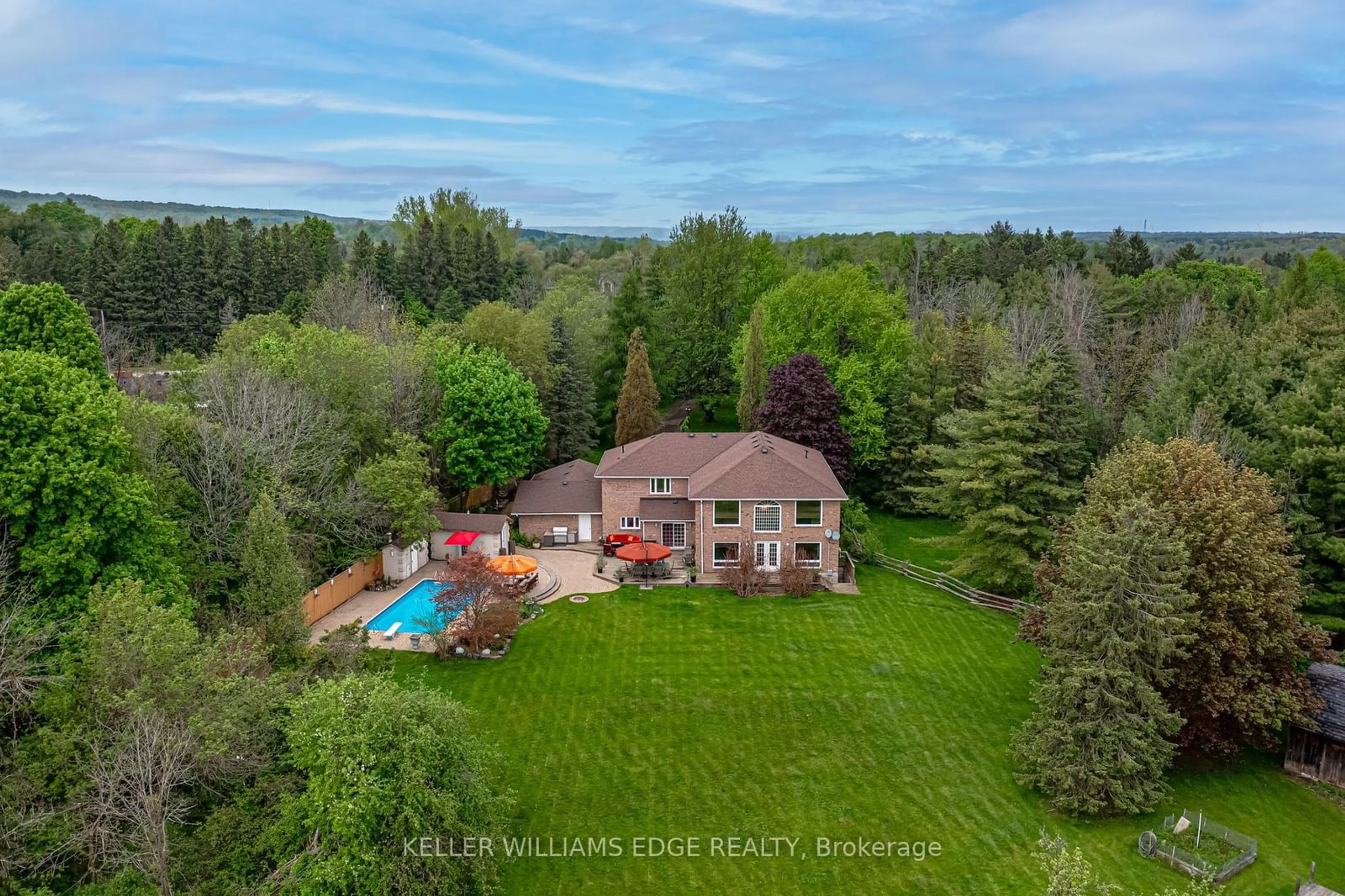 Frontside or backside of a home, the fenced backyard for 57 Kennedy Rd, Caledon Ontario L7C 2M7