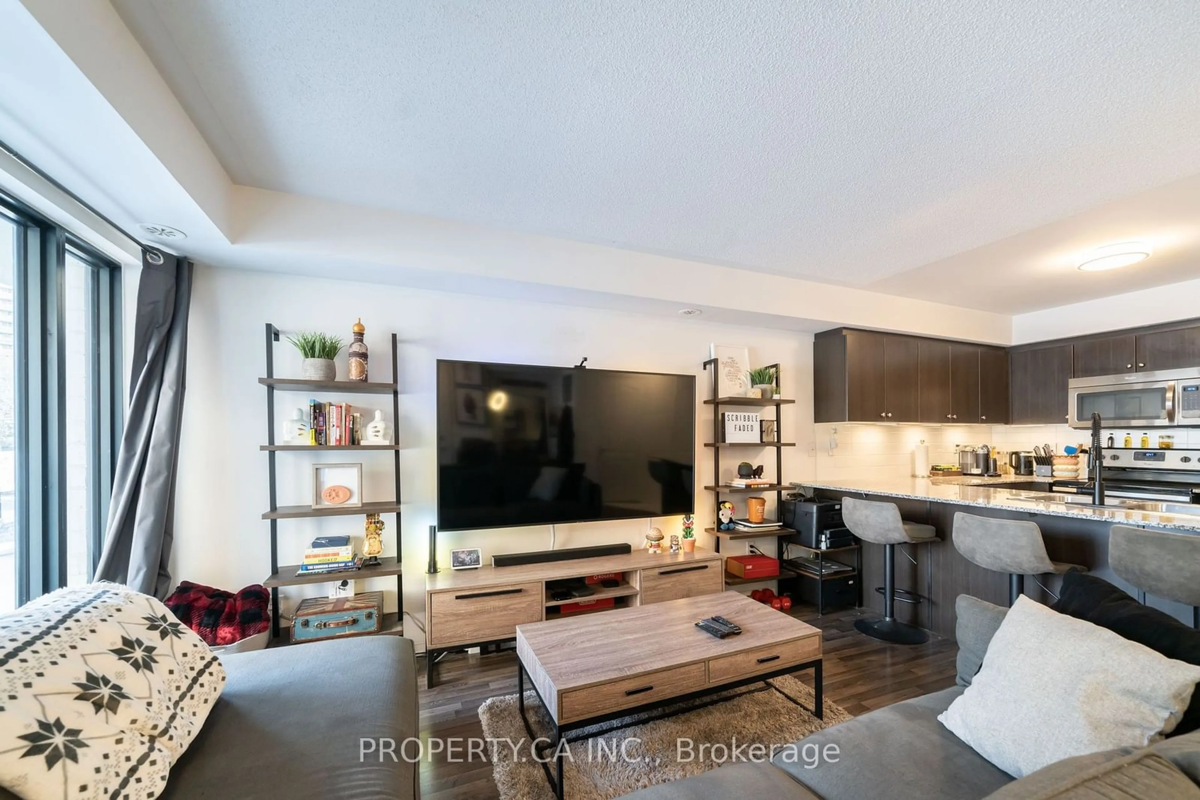 Living room, wood floors for 132 Widdicombe Hill Blvd #306, Toronto Ontario M9R 0A6