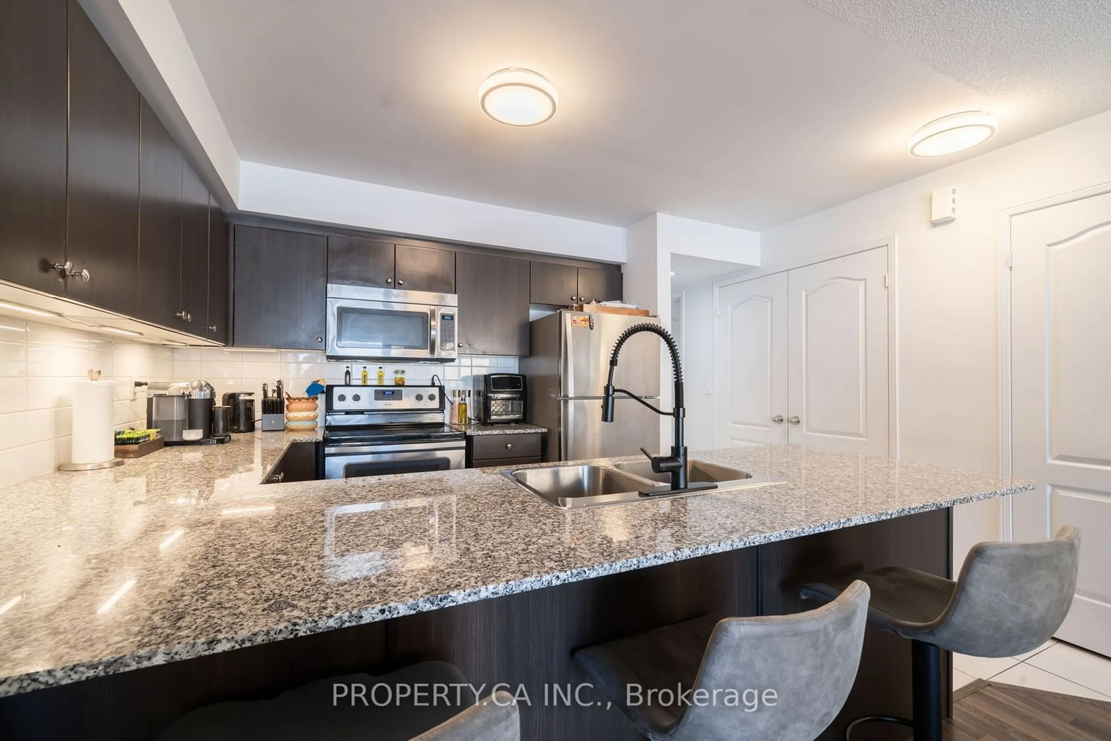 Open concept kitchen for 132 Widdicombe Hill Blvd #306, Toronto Ontario M9R 0A6