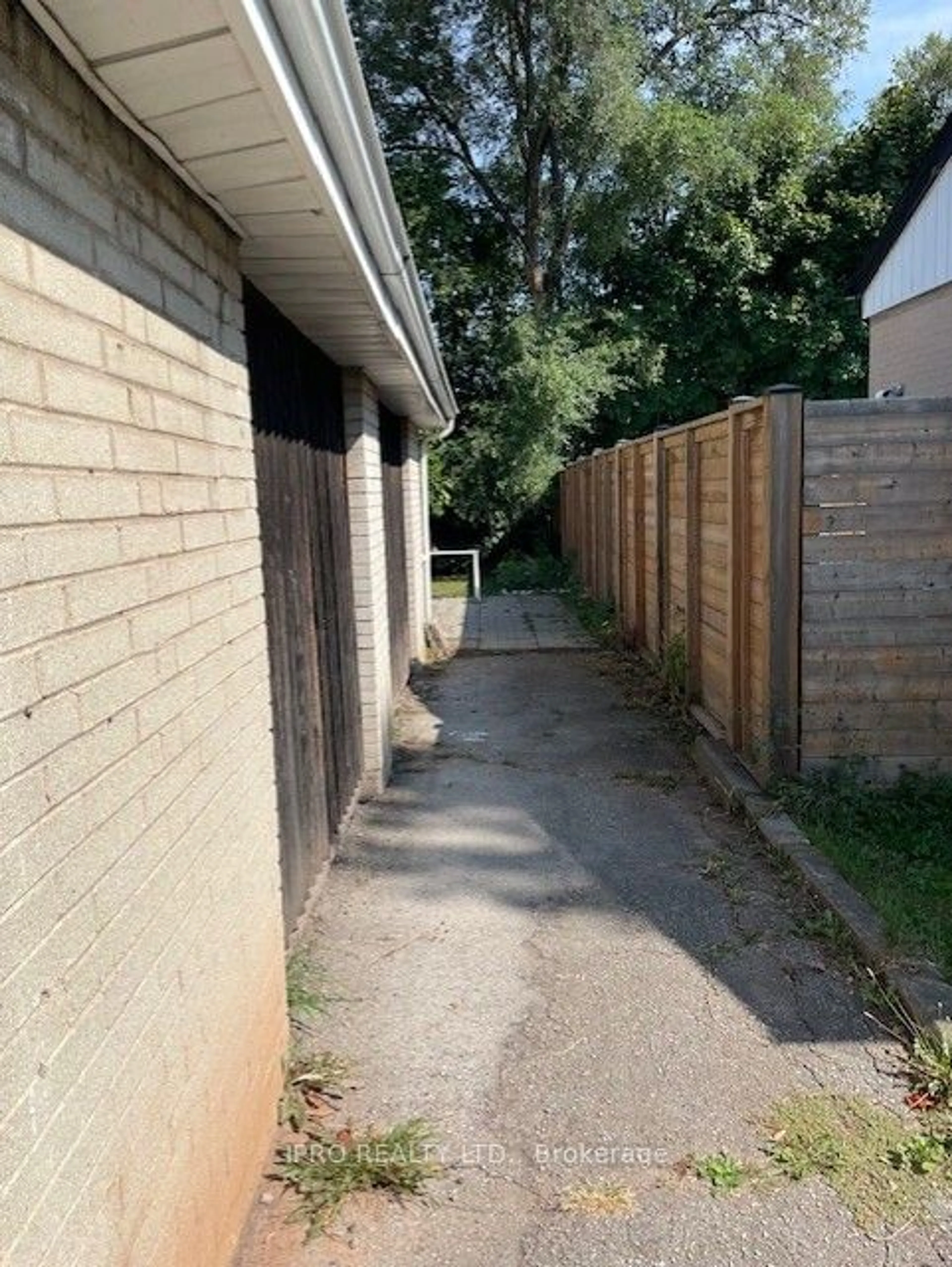 Frontside or backside of a home, the fenced backyard for 469 Third Line, Oakville Ontario L6L 4A6