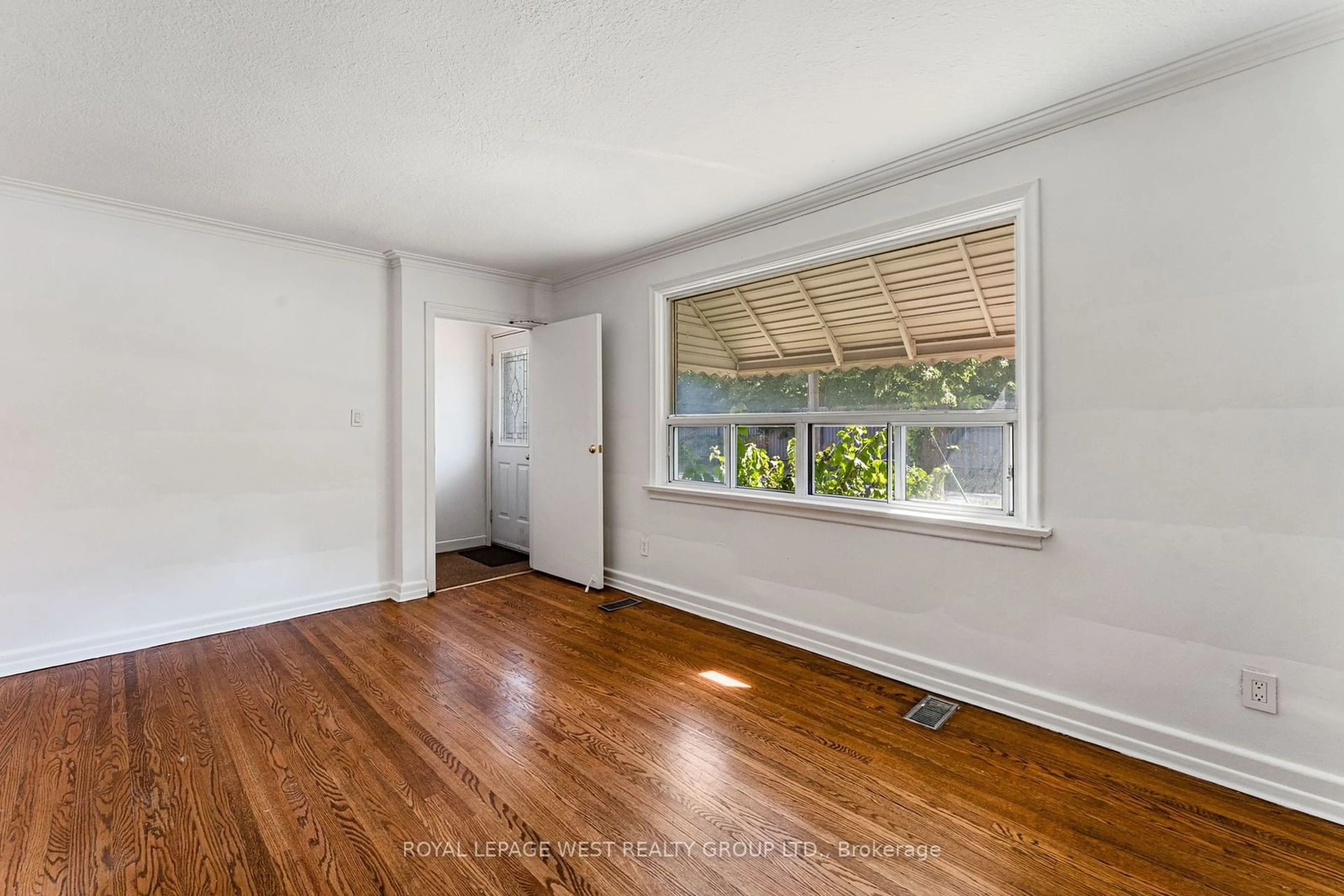 A pic of a room, wood floors for 58 Mendota Rd, Toronto Ontario M8Y 1G2