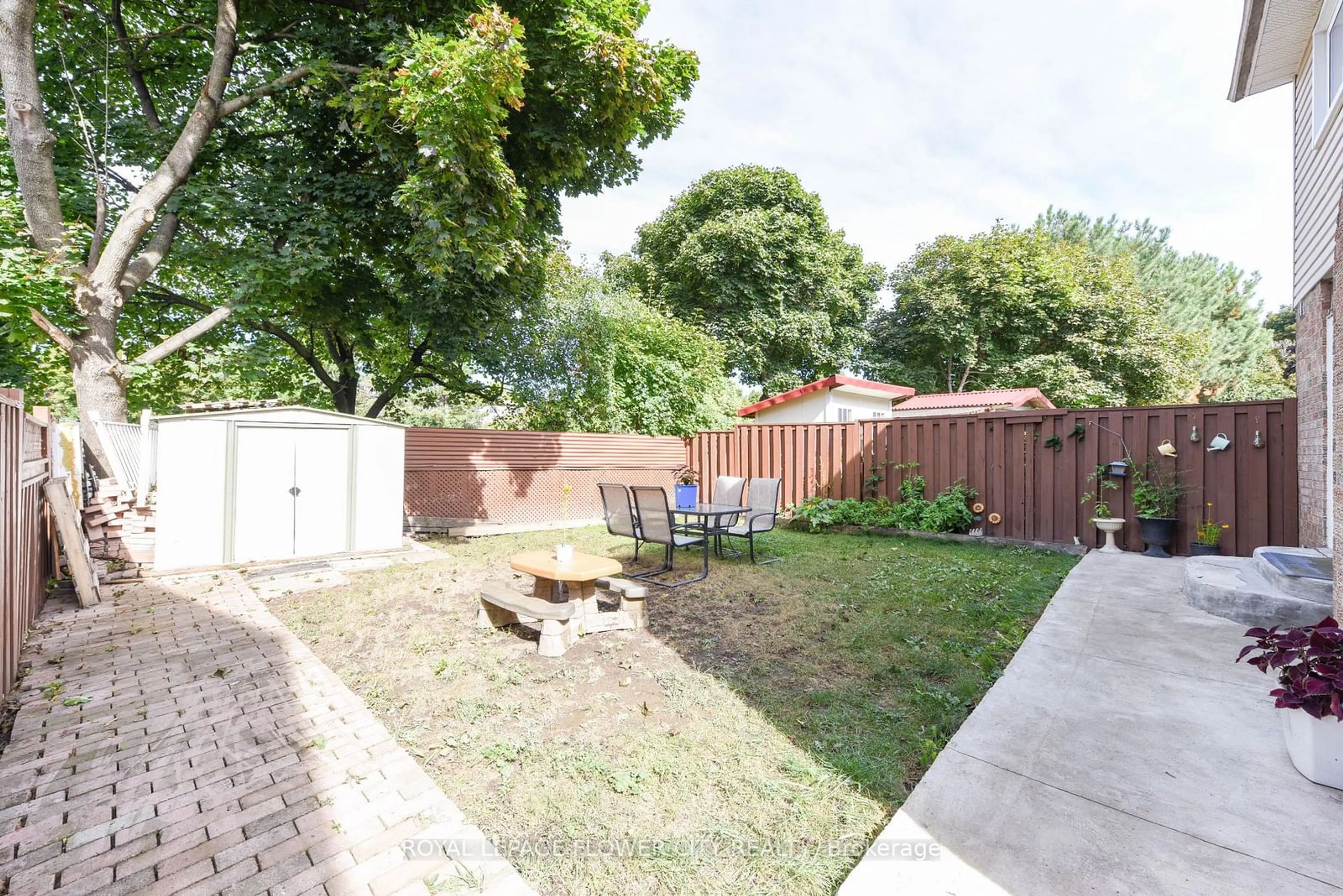 Patio, the fenced backyard for 52 Courtleigh Sq, Brampton Ontario L6Z 1J3