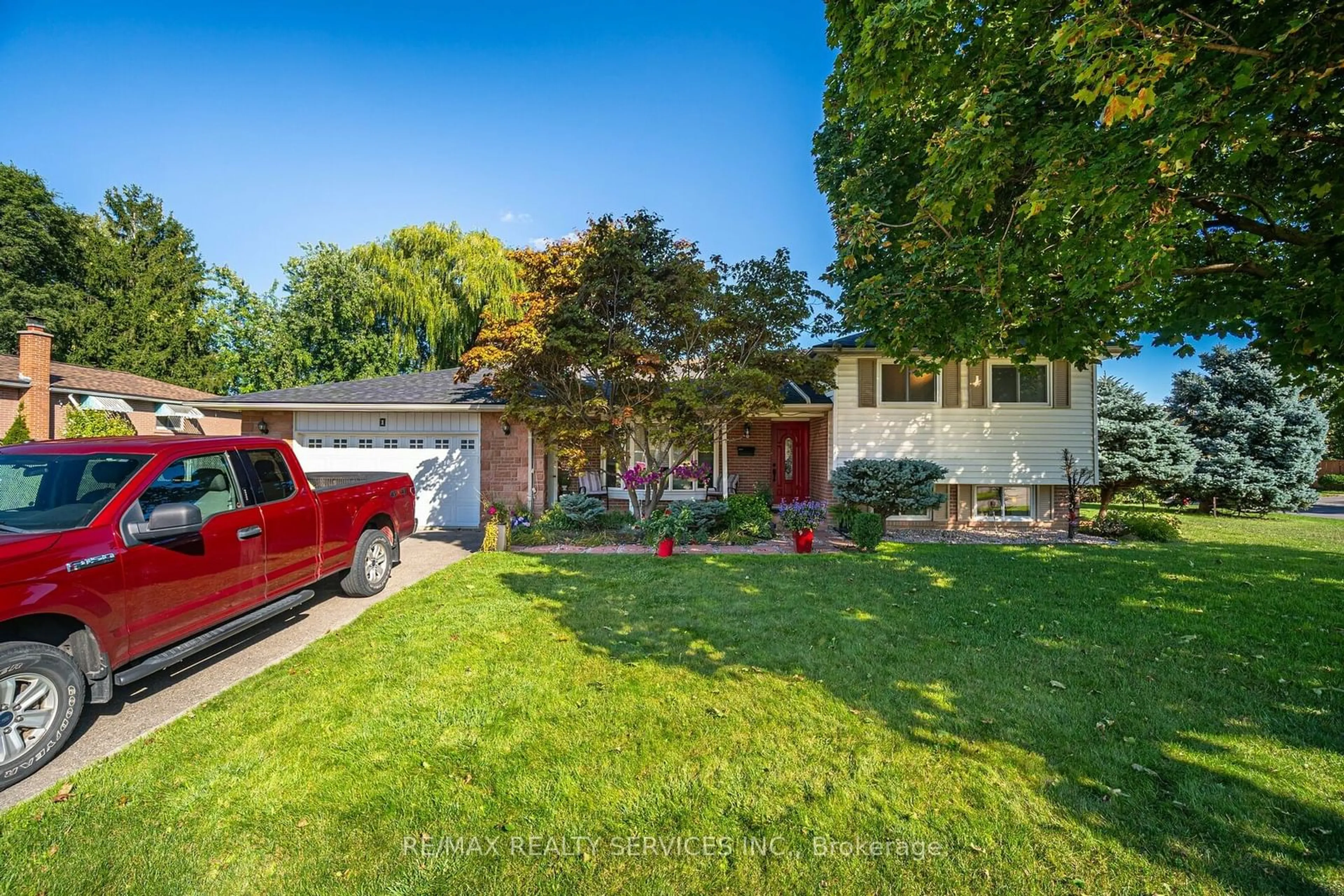 Frontside or backside of a home, the fenced backyard for 1 Ellendale Cres, Brampton Ontario L6T 3N8