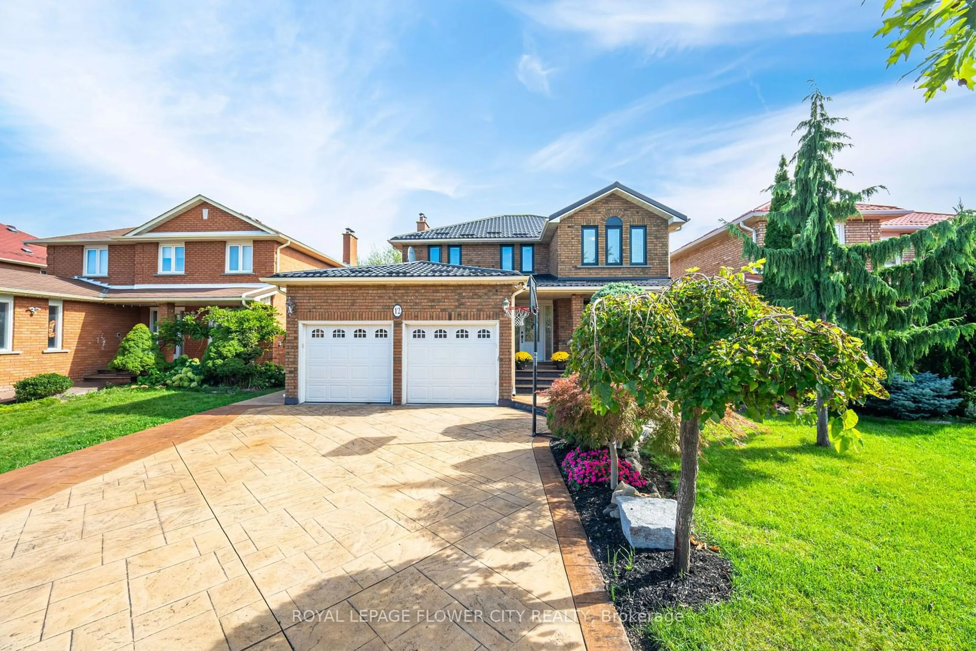 Frontside or backside of a home, the street view for 12 Creditstone Rd, Brampton Ontario L6Y 3C1