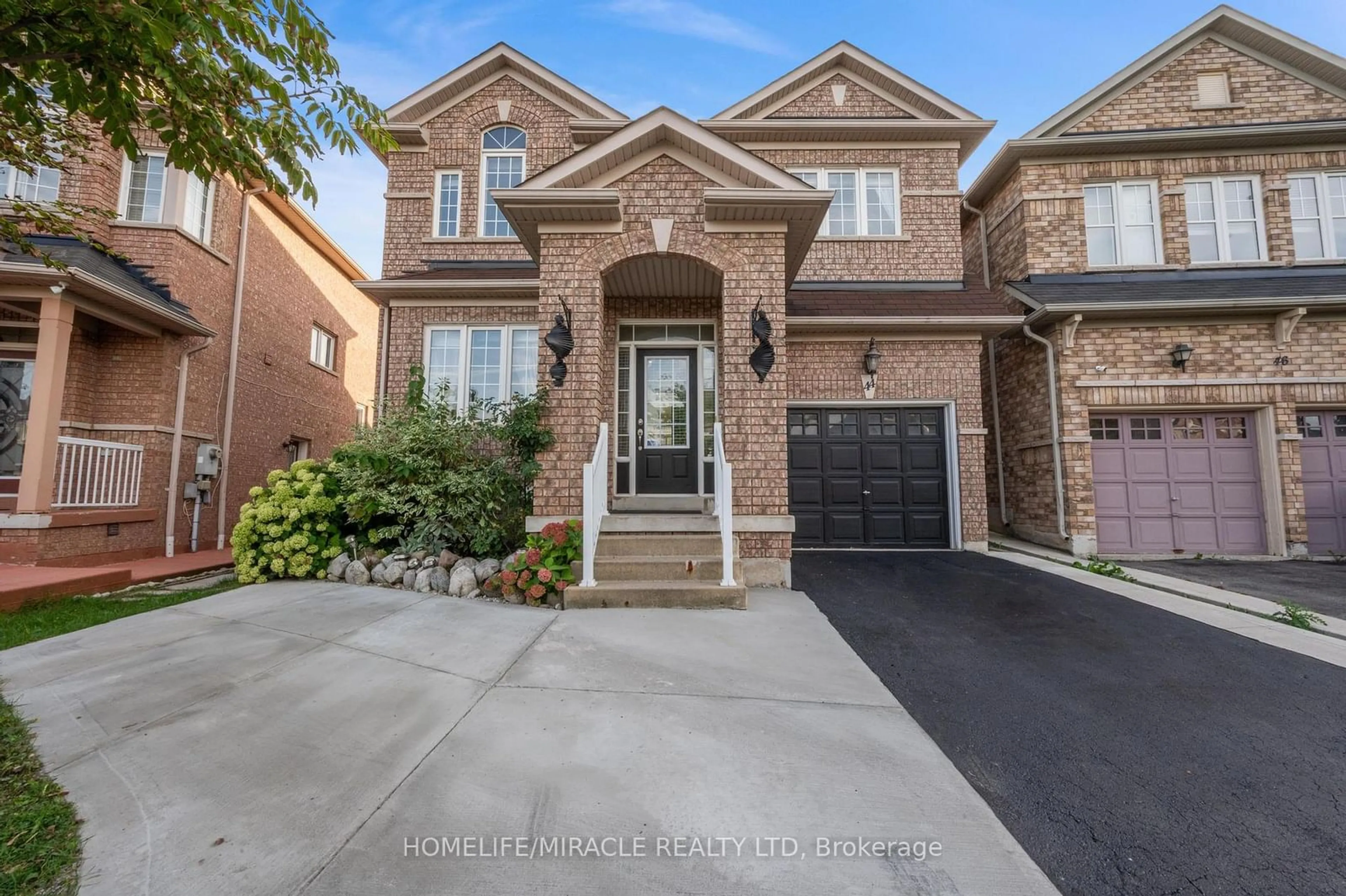 Home with brick exterior material for 44 Wellsprings Dr, Brampton Ontario L6V 4T3