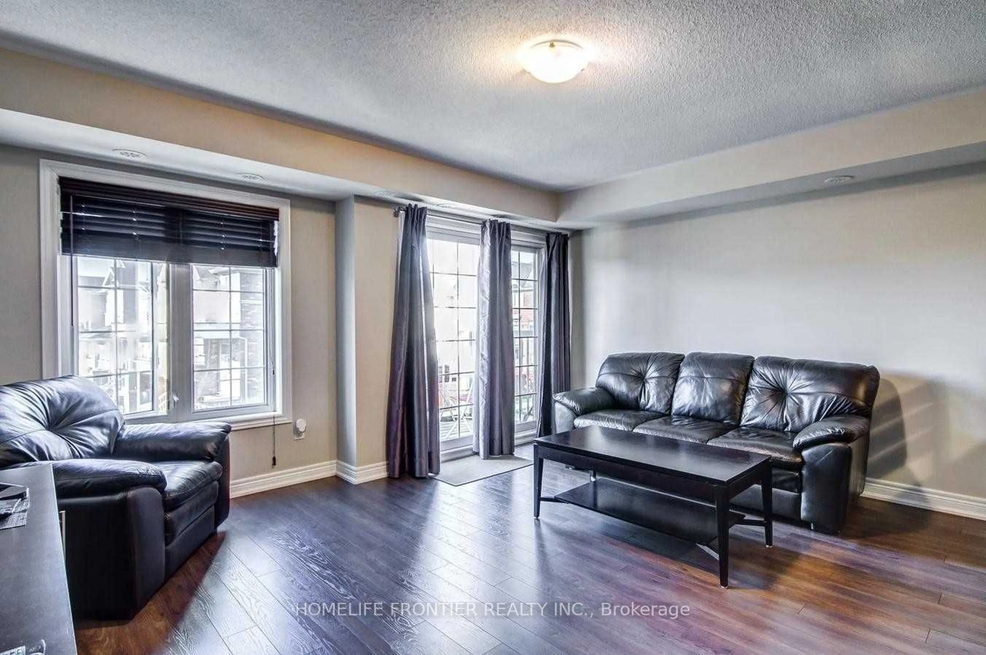 Living room, wood floors for 137 Isaac Devins Blvd #6, Toronto Ontario M9M 0C4