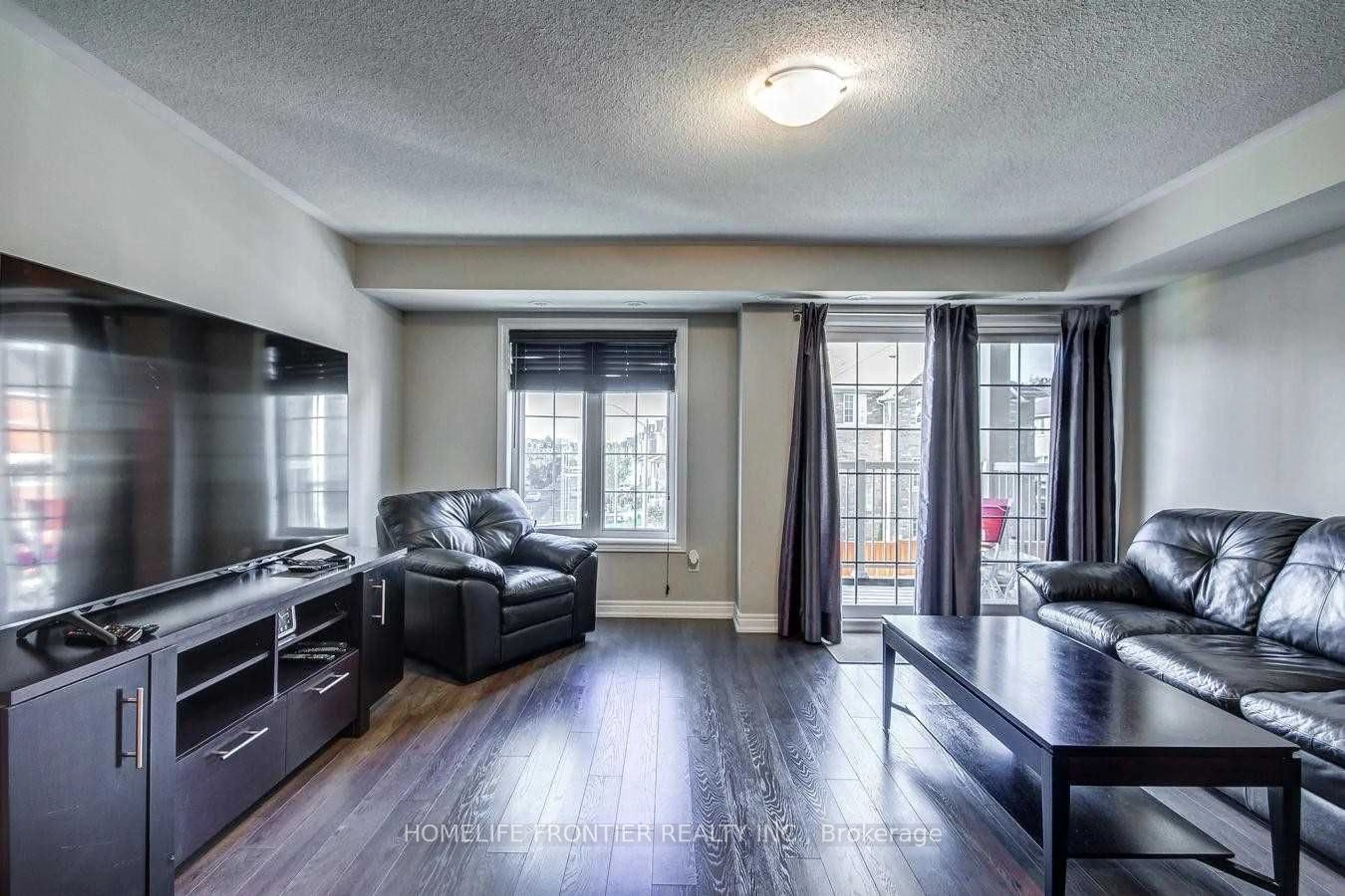 Living room, wood floors for 137 Isaac Devins Blvd #6, Toronto Ontario M9M 0C4