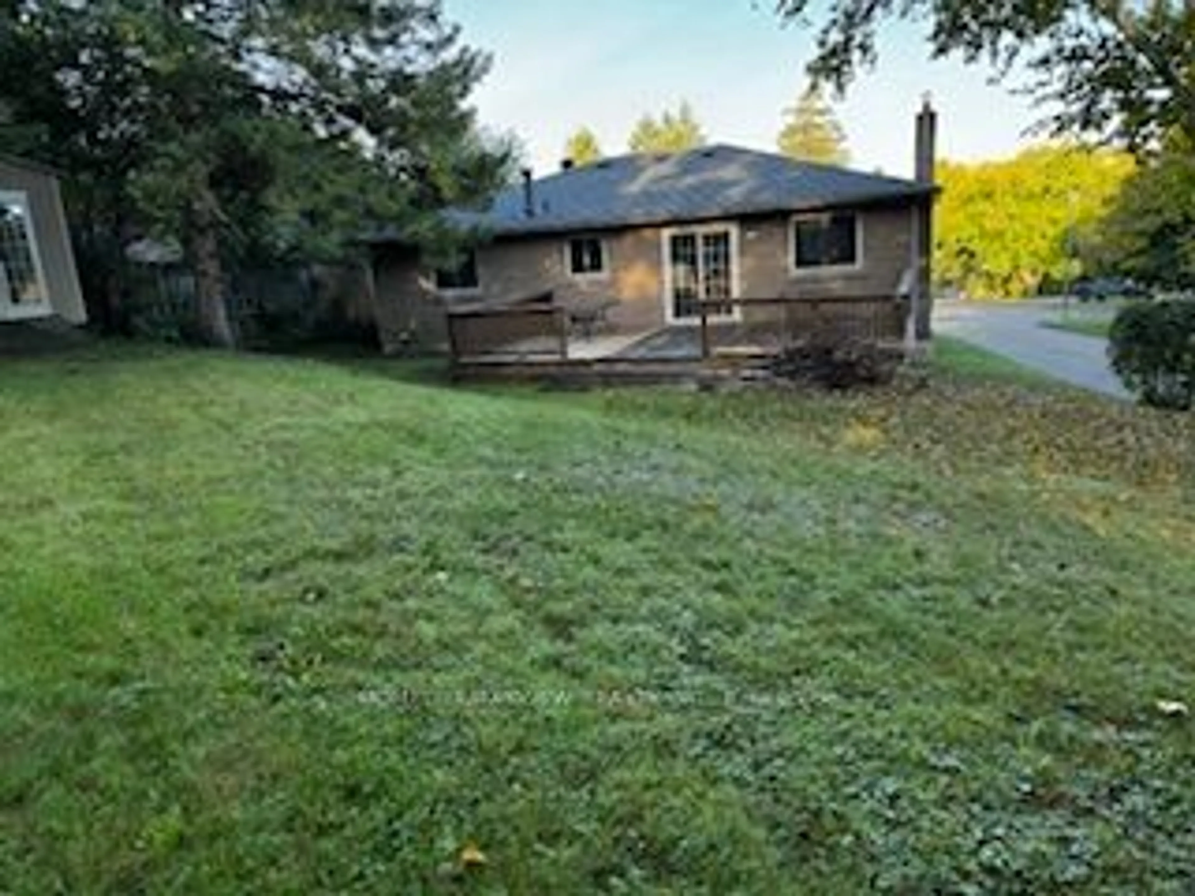 Frontside or backside of a home, the fenced backyard for 49 Hilltop Crt, Caledon Ontario L7E 2P8