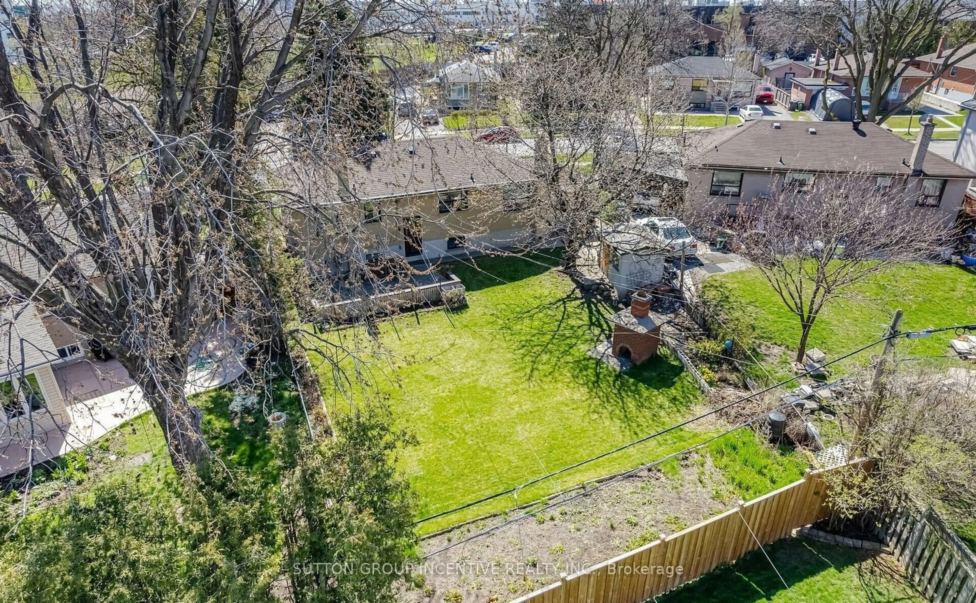 A pic from exterior of the house or condo, the fenced backyard for 98 Stavely Cres, Toronto Ontario M9W 2C8