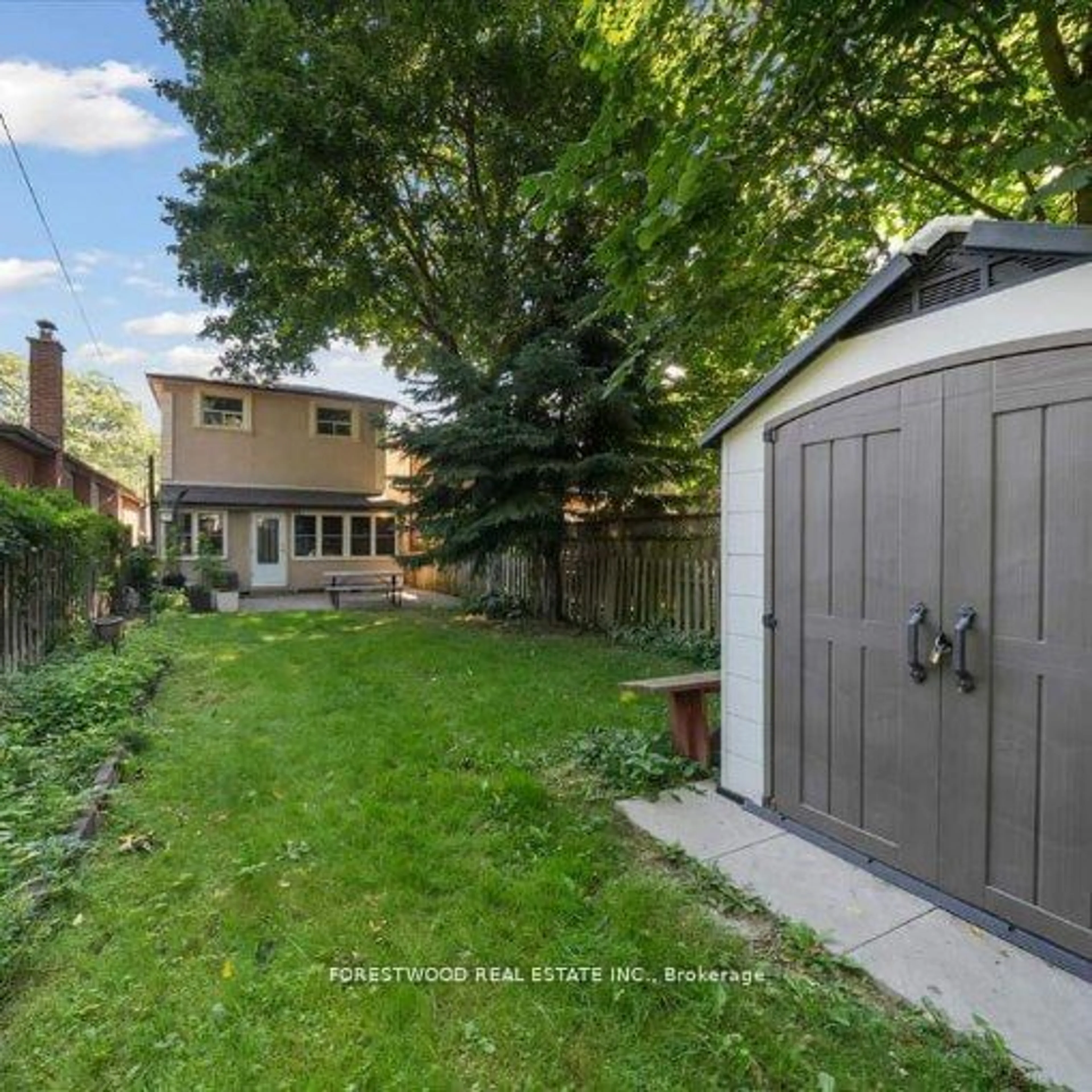 Frontside or backside of a home, the fenced backyard for 26 Thirty Eighth St, Toronto Ontario M8W 3L9