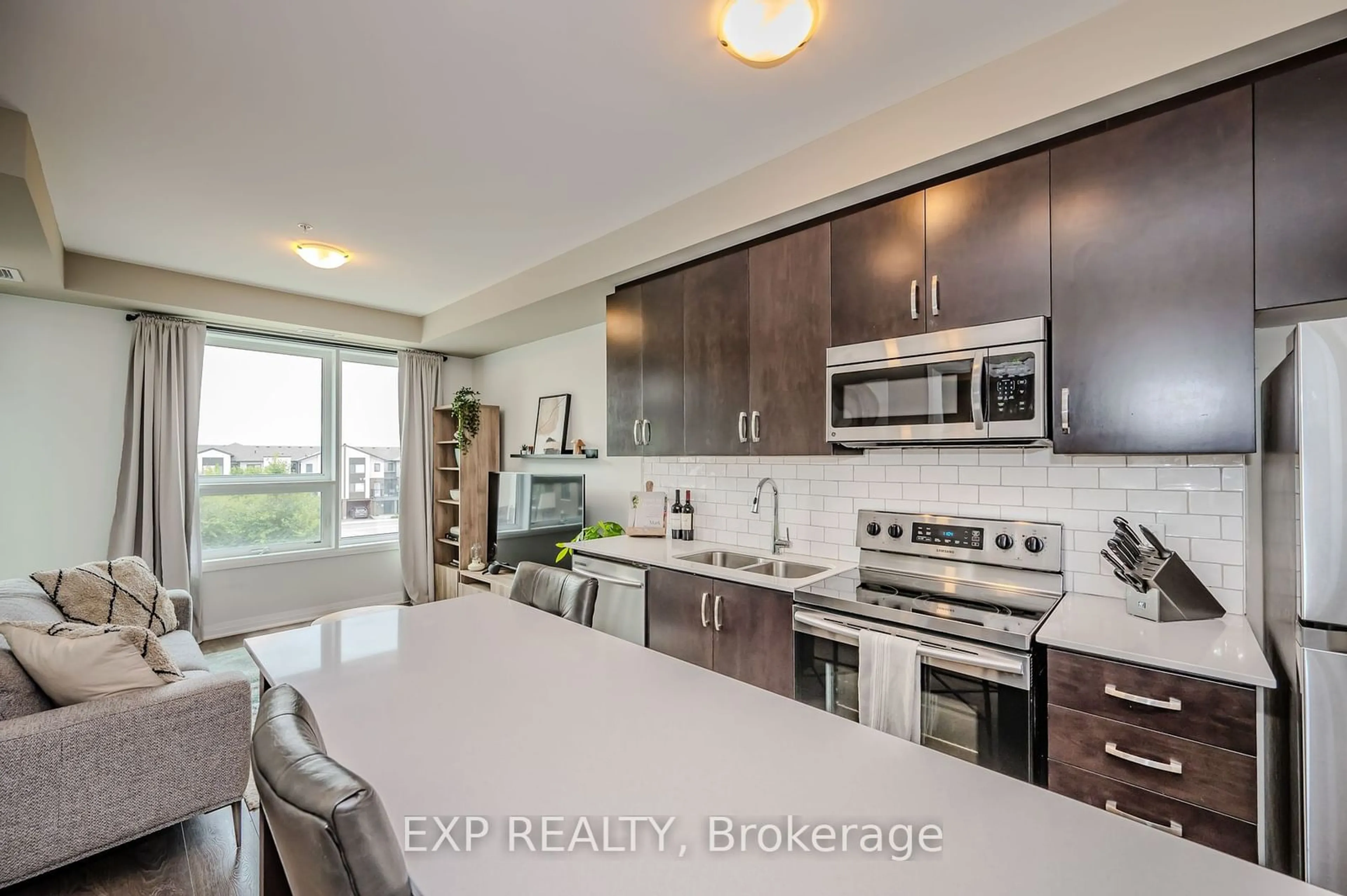 Open concept kitchen for 1105 Leger Way #304, Milton Ontario L9E 1K7