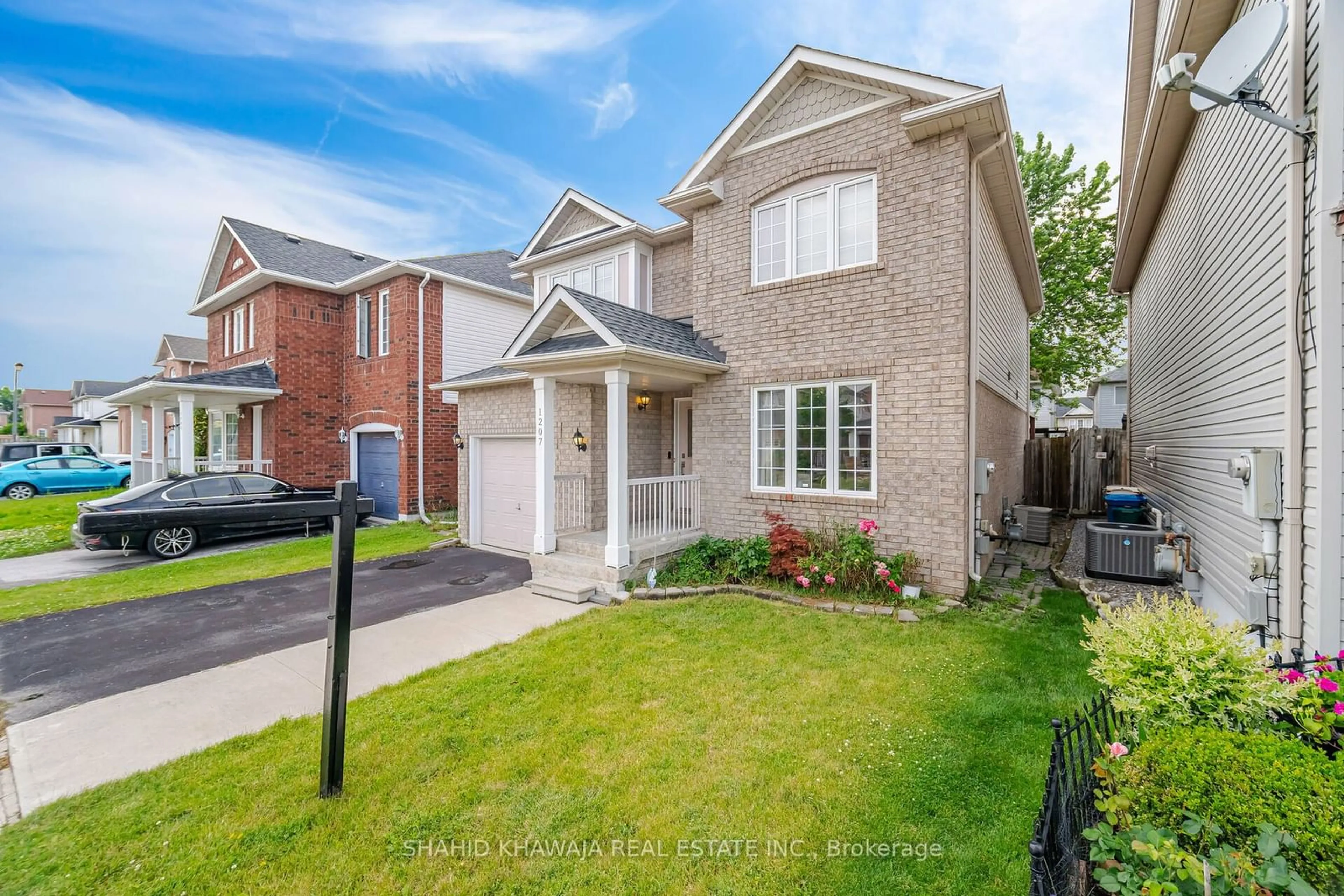 Frontside or backside of a home, the fenced backyard for 1207 Newell St, Milton Ontario L9T 5R5