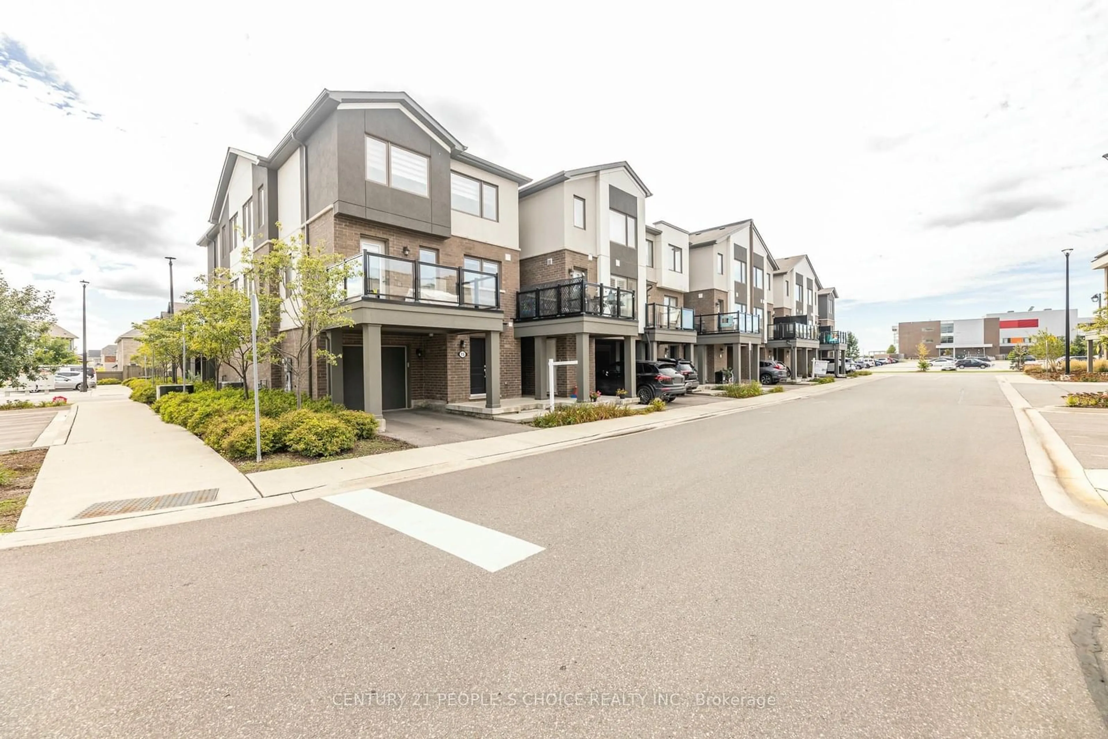 A pic from exterior of the house or condo, the street view for 1125 Leger Way #15, Milton Ontario L9E 1N7