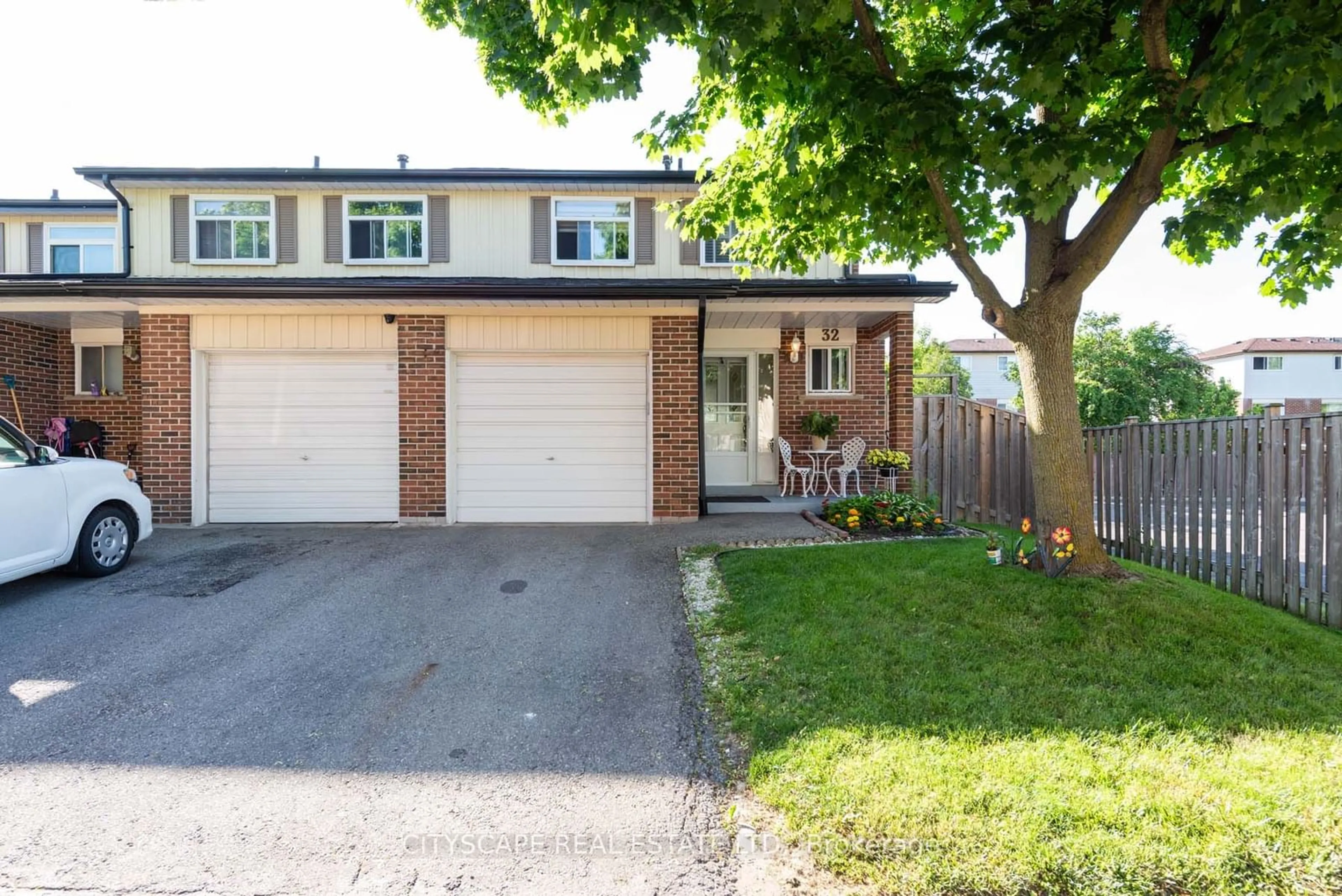 A pic from exterior of the house or condo, the fenced backyard for 32 Vodden Crt, Brampton Ontario L6V 2V7