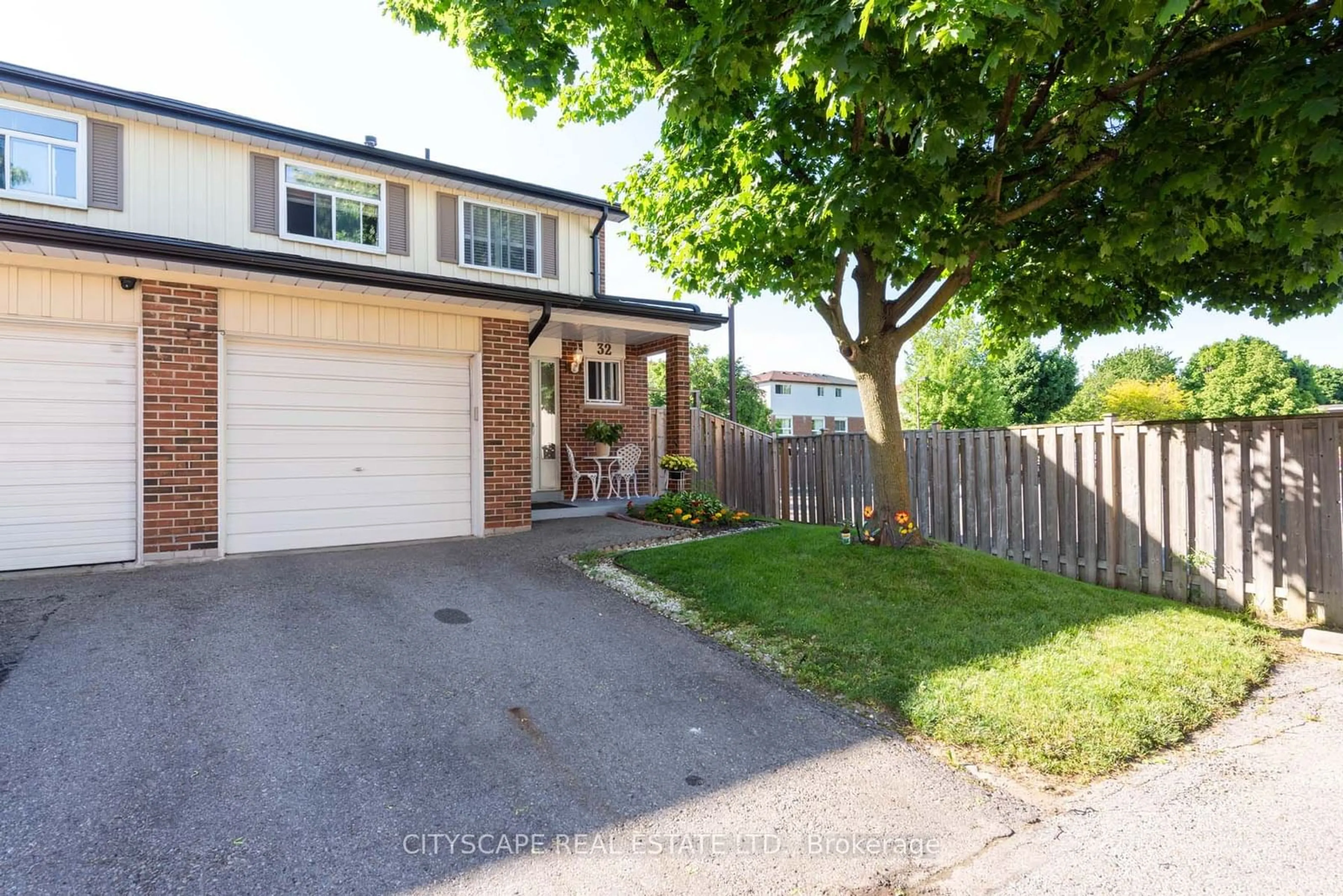 A pic from exterior of the house or condo, the fenced backyard for 32 Vodden Crt, Brampton Ontario L6V 2V7