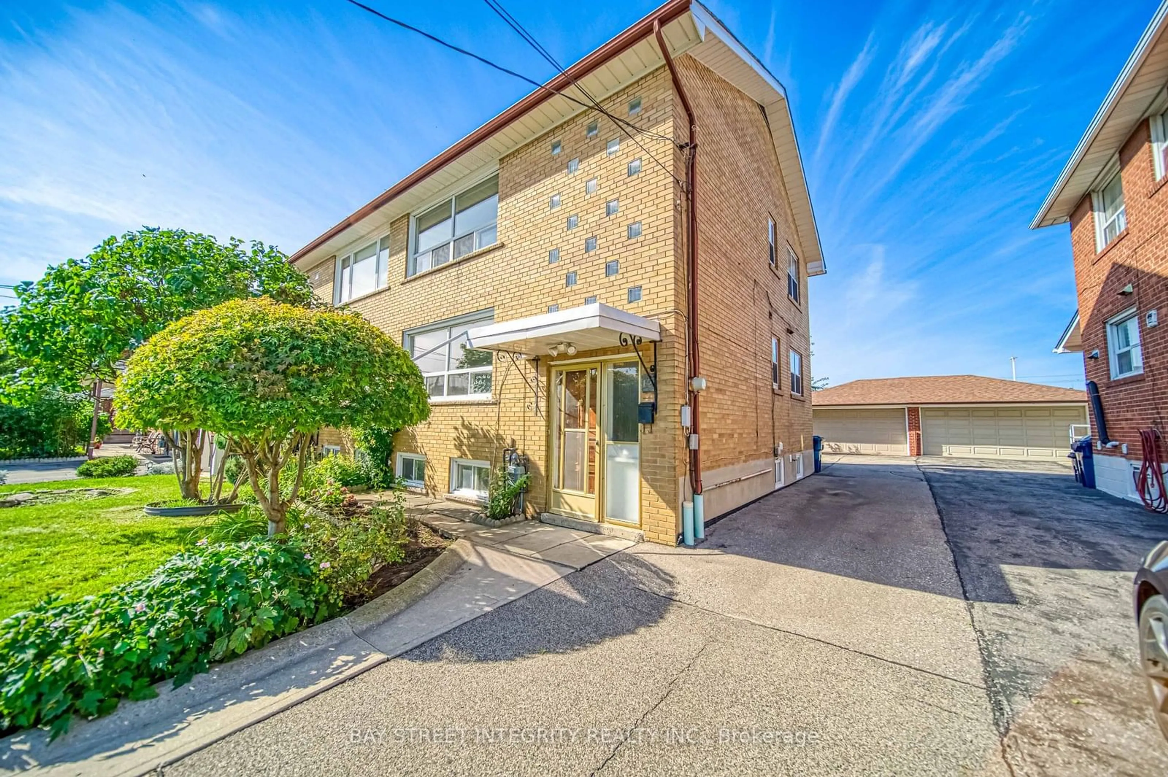 A pic from exterior of the house or condo, the street view for 12 Martini Dr, Toronto Ontario M6M 4X5