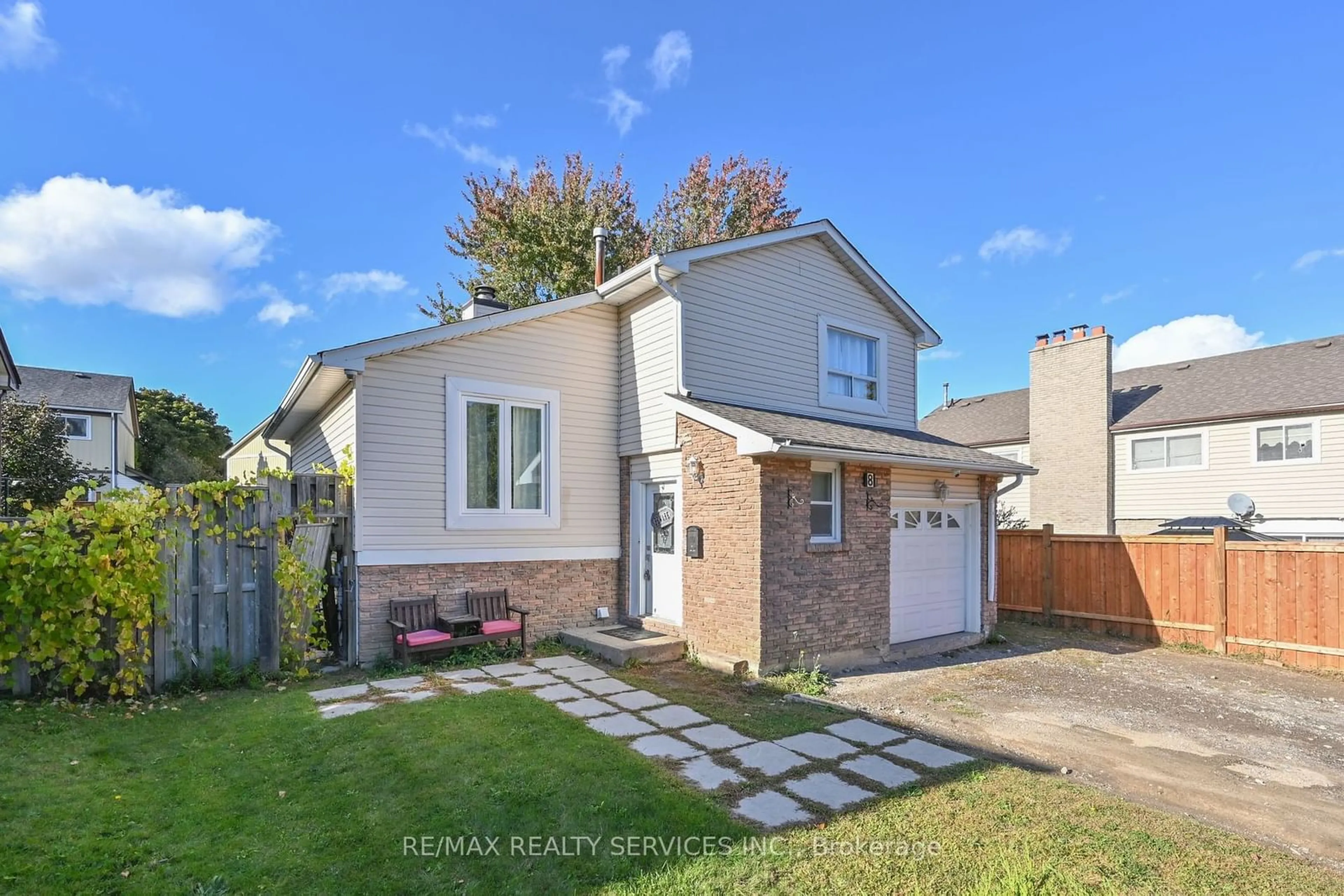 Frontside or backside of a home, the fenced backyard for 8 Mount Pleasant Dr, Brampton Ontario L6Z 1J9