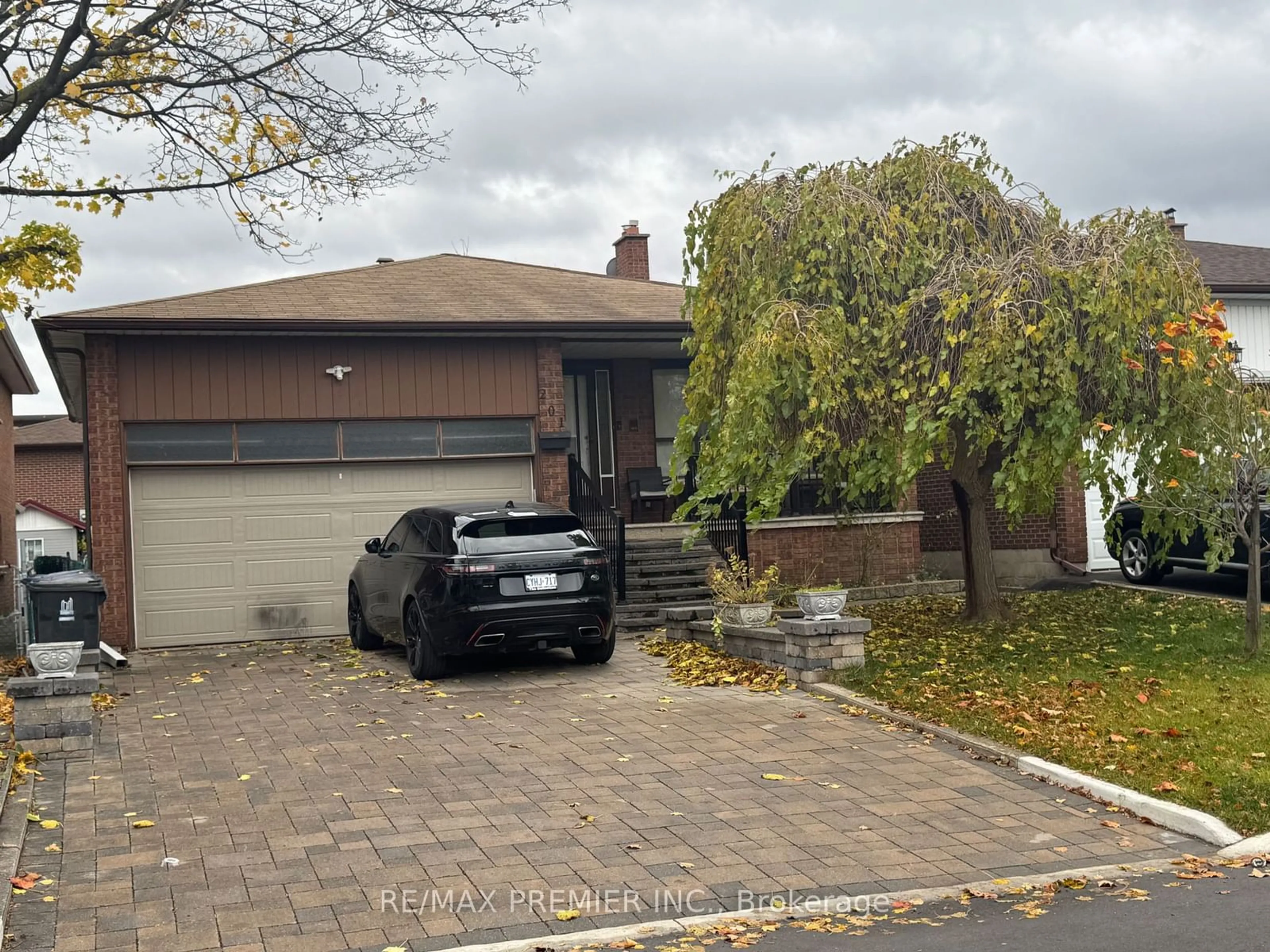 Frontside or backside of a home, the street view for 201 Wright Ave, Toronto Ontario M9N 3S5