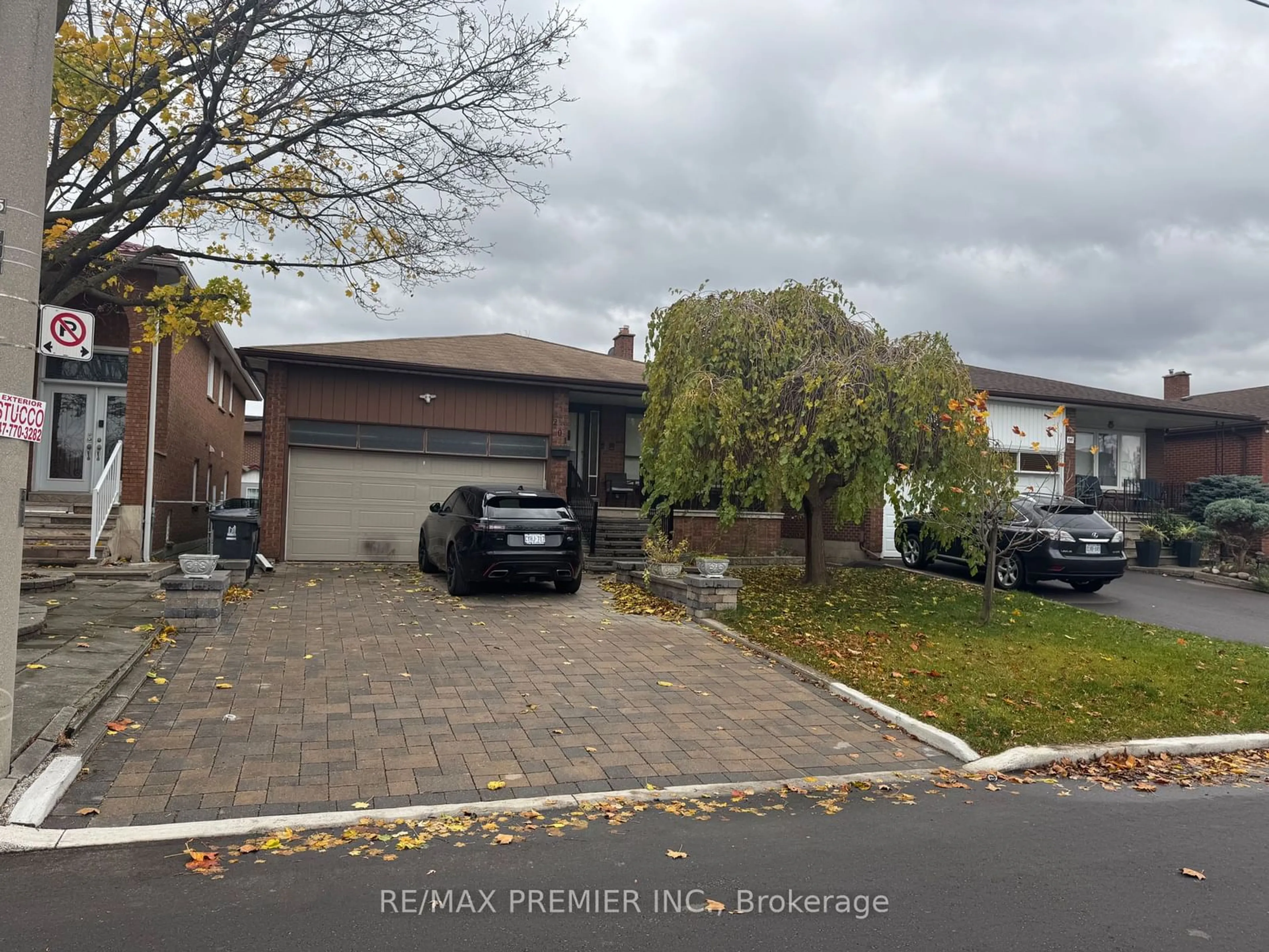 Frontside or backside of a home, the street view for 201 Wright Ave, Toronto Ontario M9N 3S5