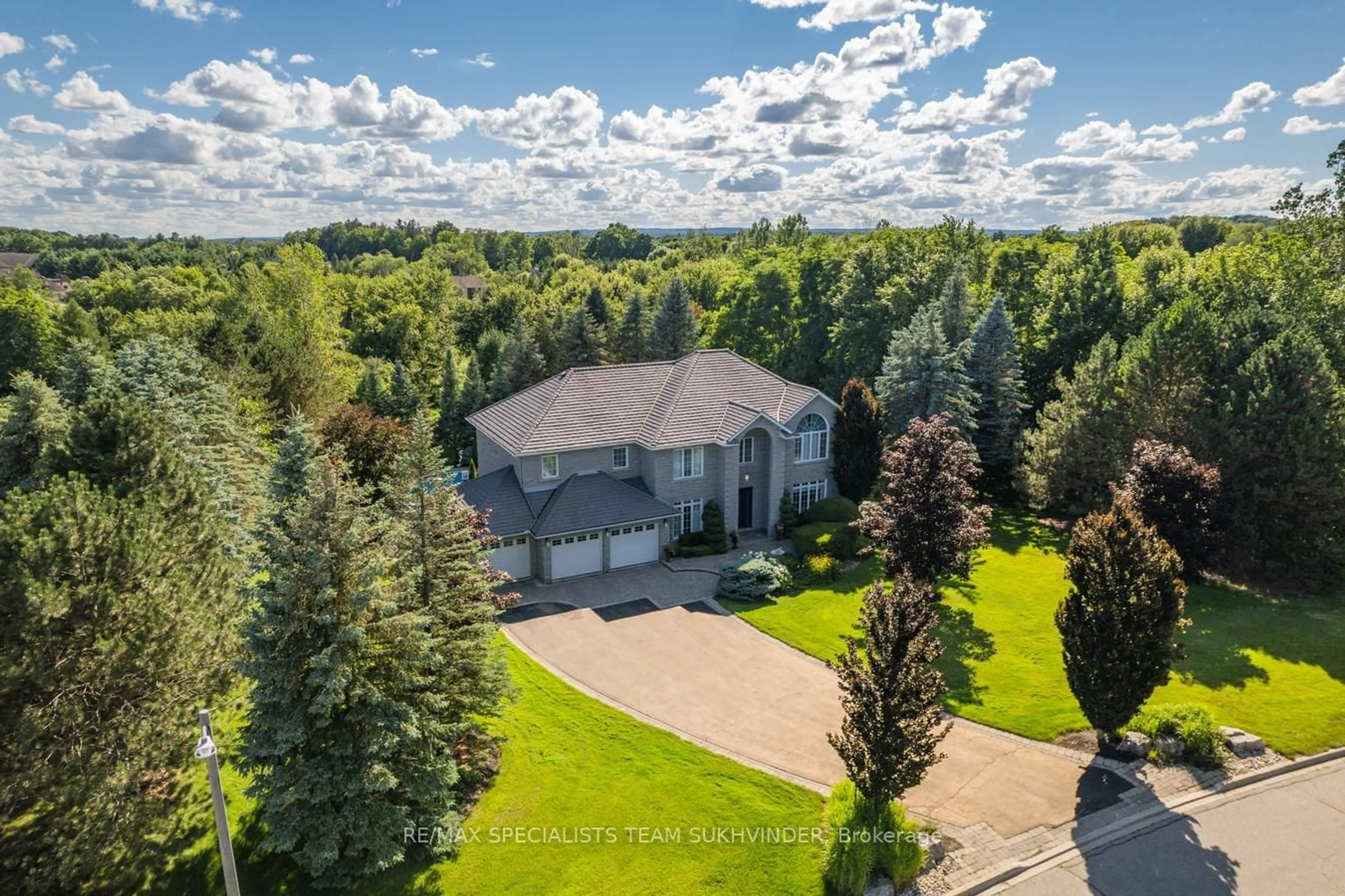 A pic from exterior of the house or condo, the fenced backyard for 4 Stonehart St, Caledon Ontario L7E 0B7