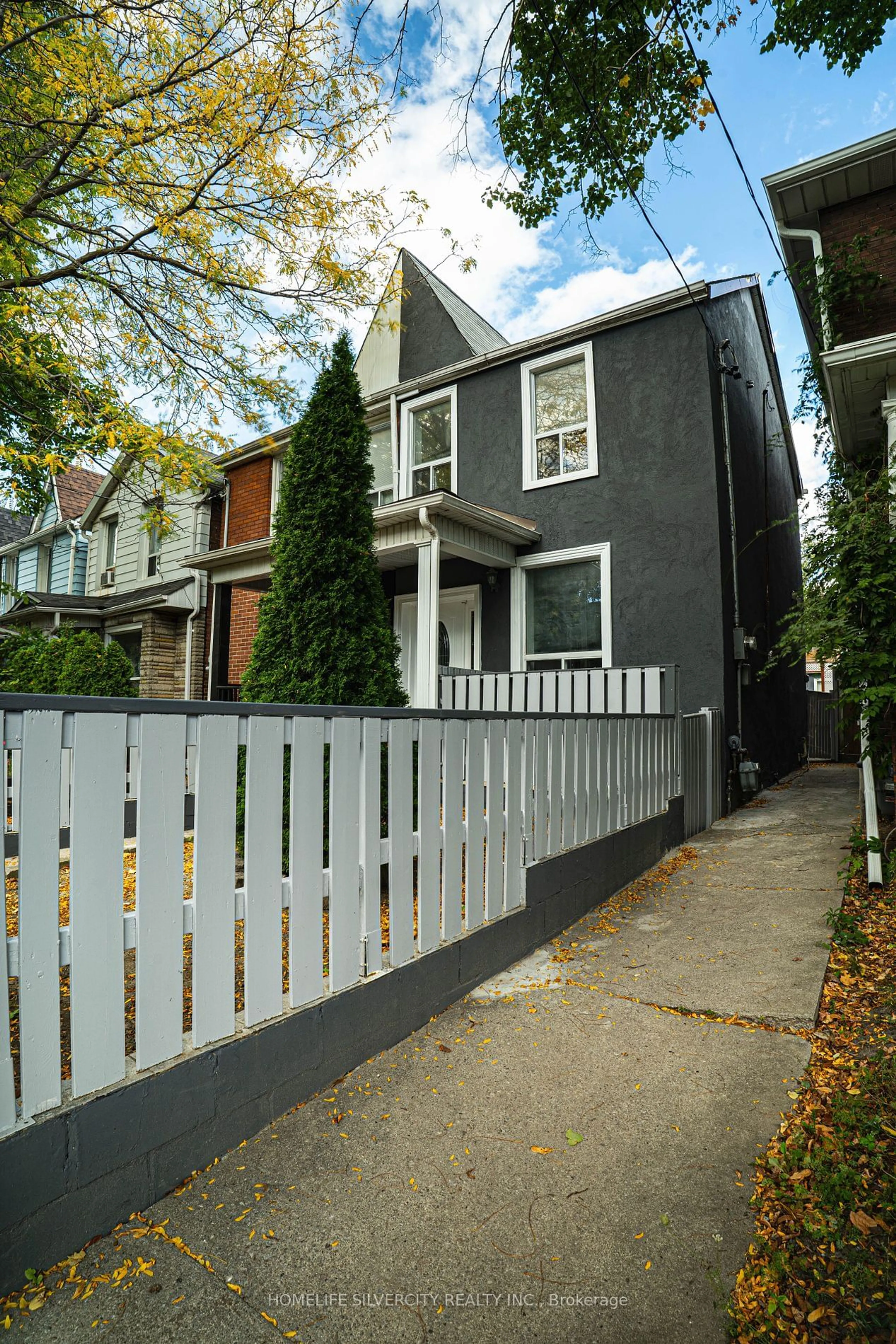 Frontside or backside of a home, the fenced backyard for 47 Osler St, Toronto Ontario M6P 4A1