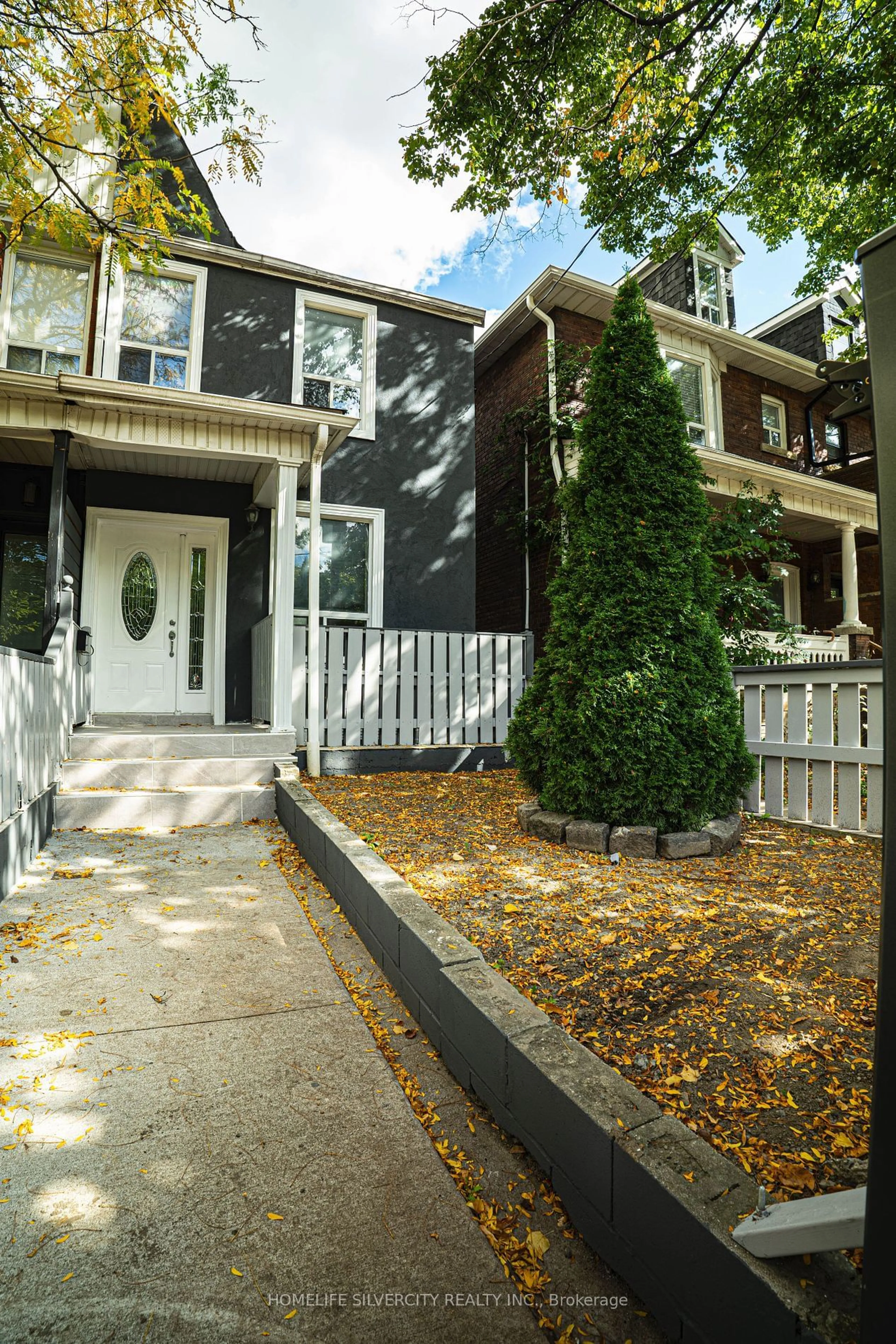 A pic from exterior of the house or condo, the fenced backyard for 47 Osler St, Toronto Ontario M6P 4A1