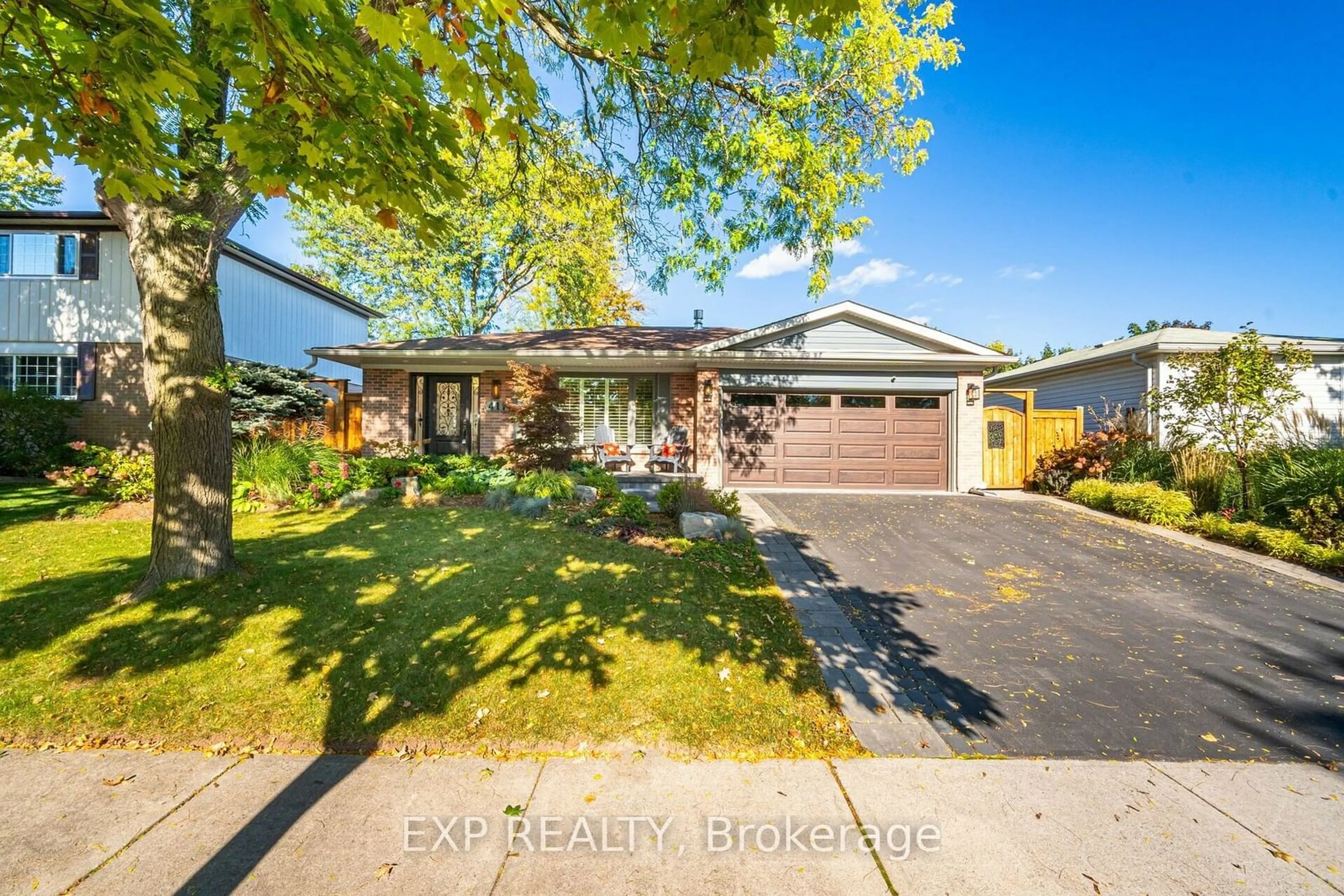 Frontside or backside of a home, the street view for 411 Sunset Dr, Oakville Ontario L6L 3N3