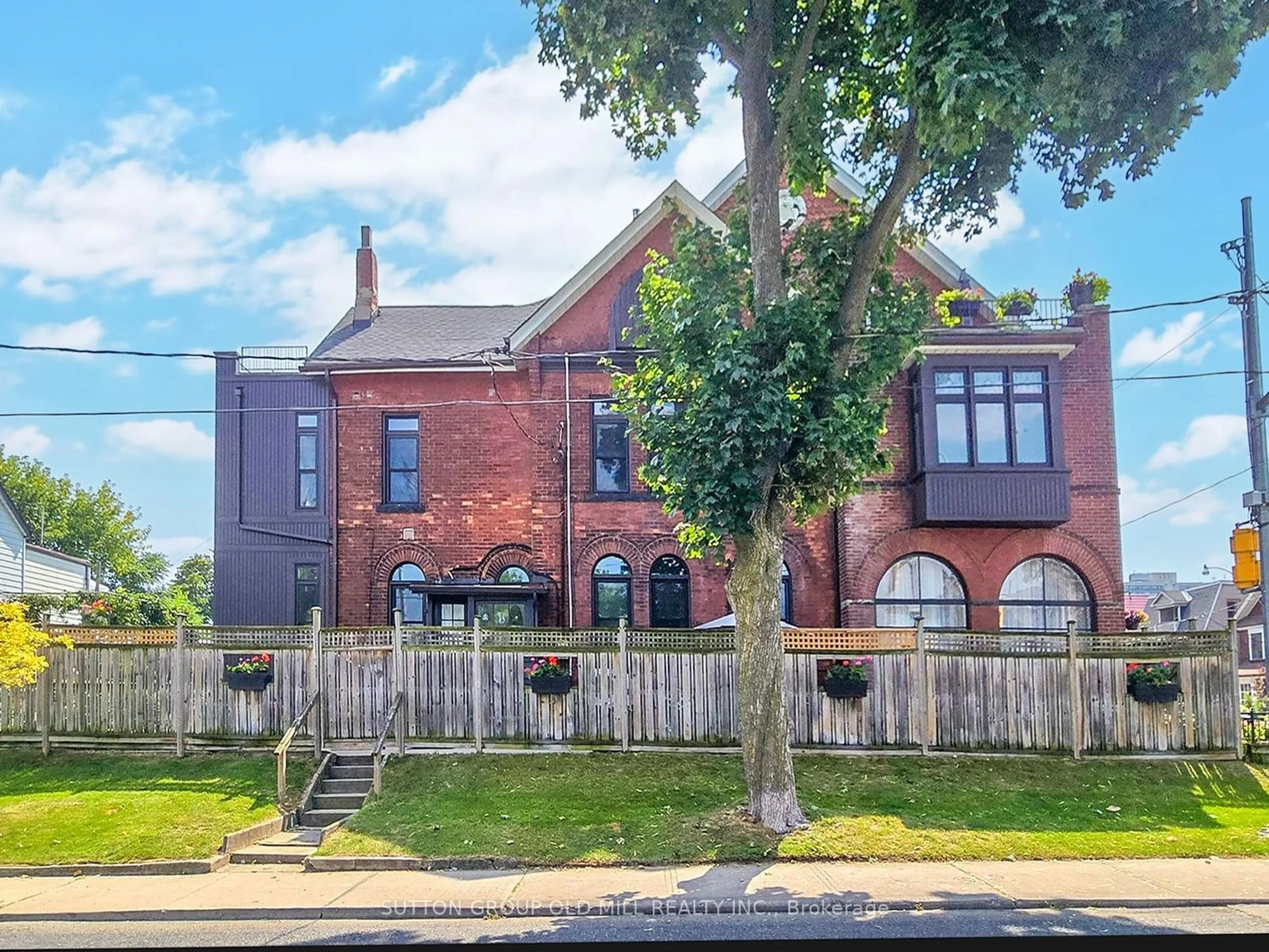 Frontside or backside of a home, the fenced backyard for 263 Keele St, Toronto Ontario M6P 2K1