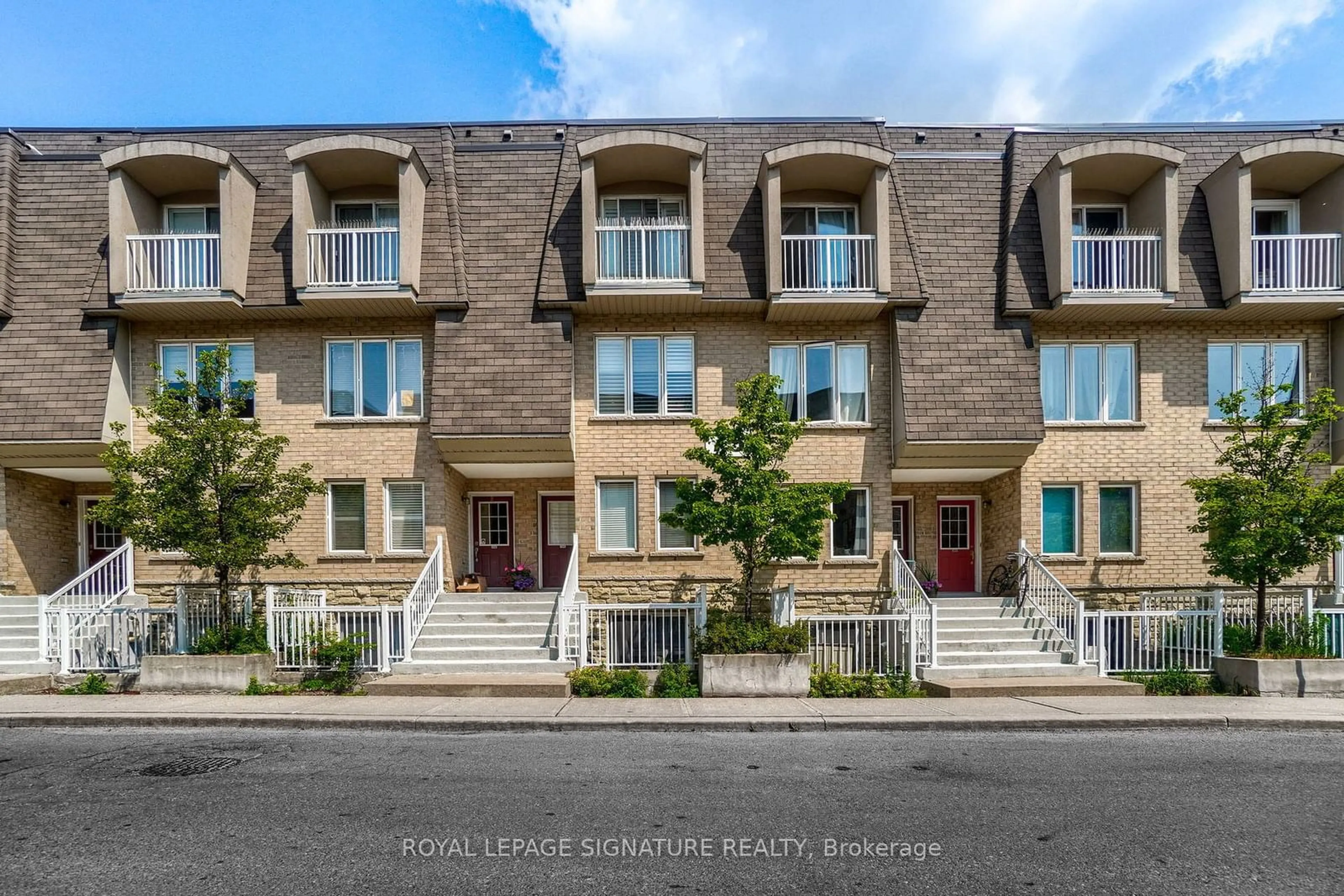 A pic from exterior of the house or condo, the street view for 75 Turntable Cres #124, Toronto Ontario M6H 4K8