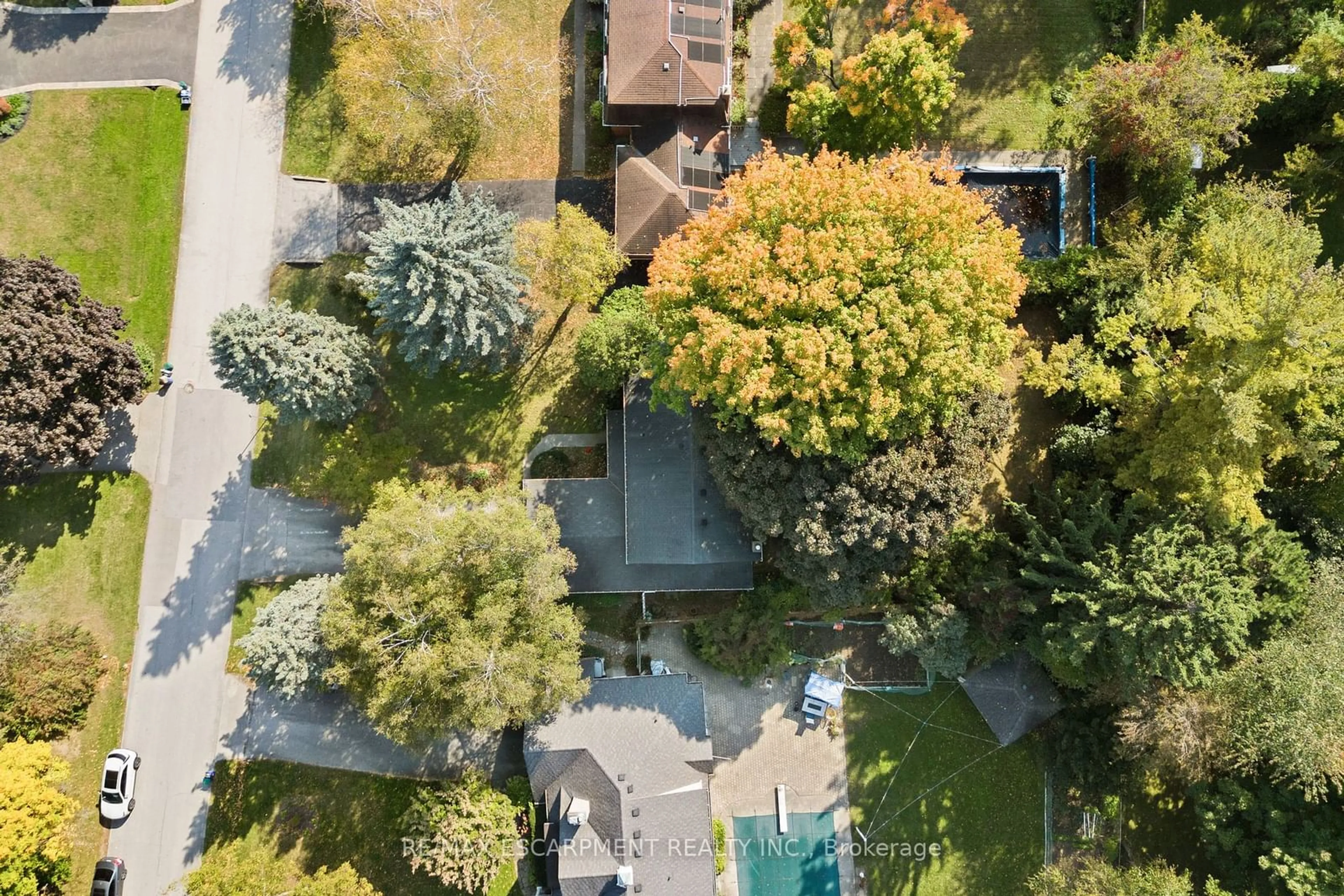 Frontside or backside of a home, the fenced backyard for 214 Donessle Dr, Oakville Ontario L6J 3Y6