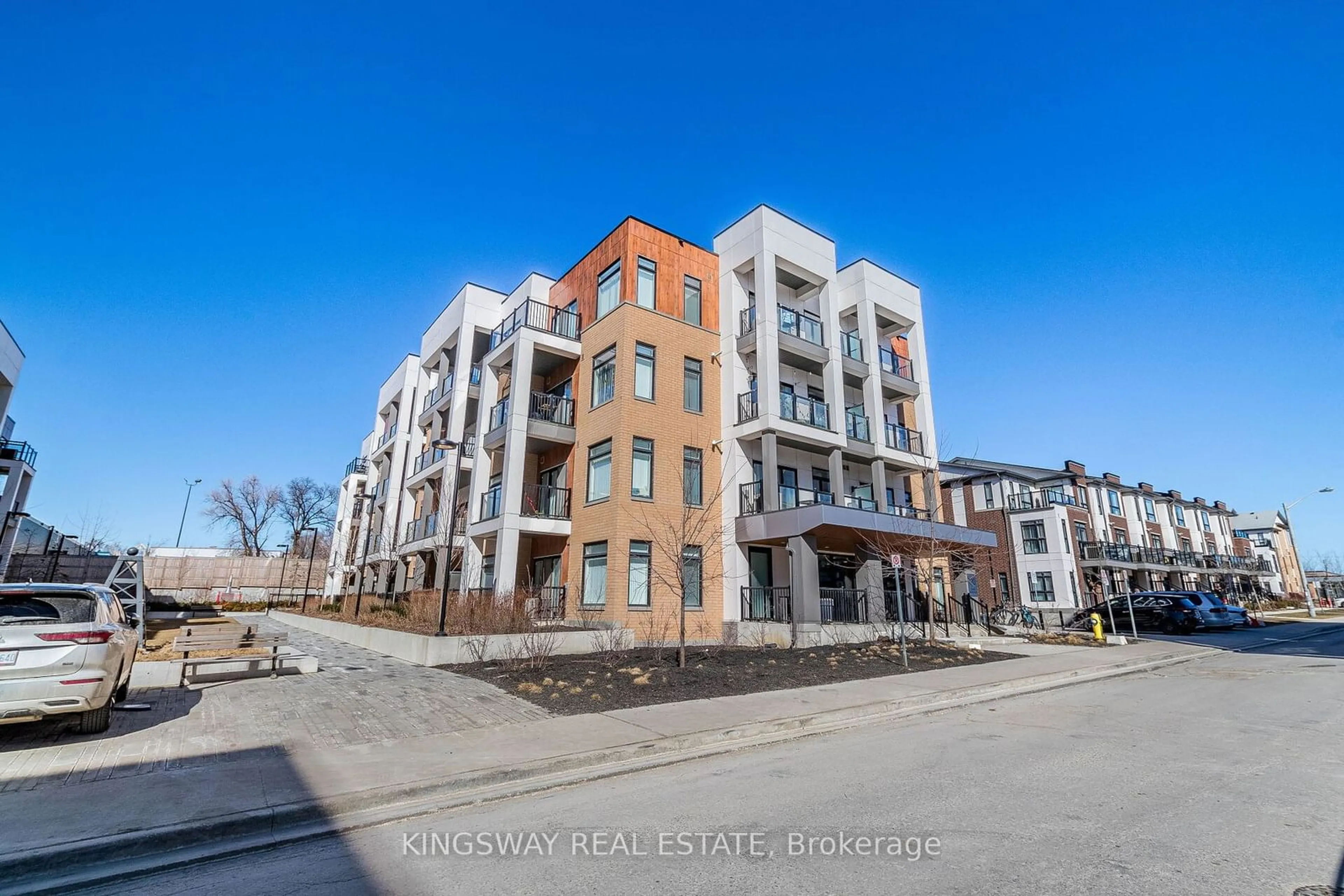 A pic from exterior of the house or condo, the street view for 120 Canon Jackson Dr #101, Toronto Ontario M6M 0B8