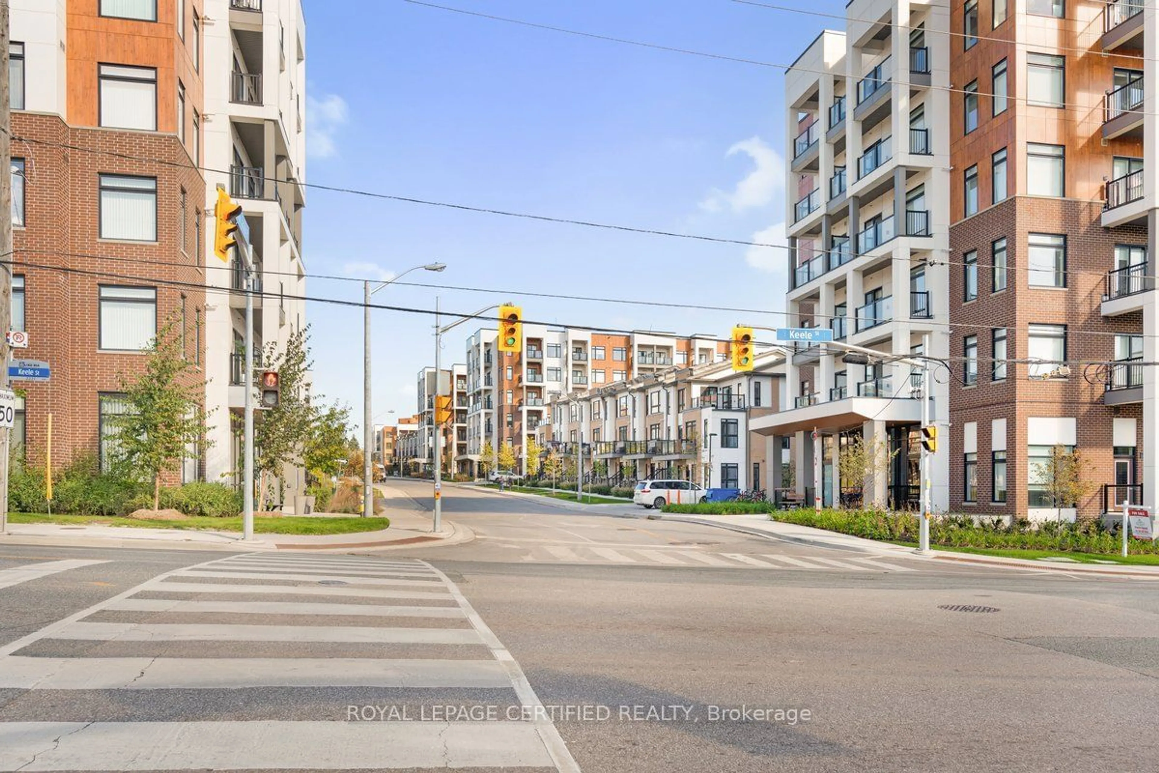 A pic from exterior of the house or condo, the street view for 165 Canon Jackson Dr #313, Toronto Ontario M6M 0C4