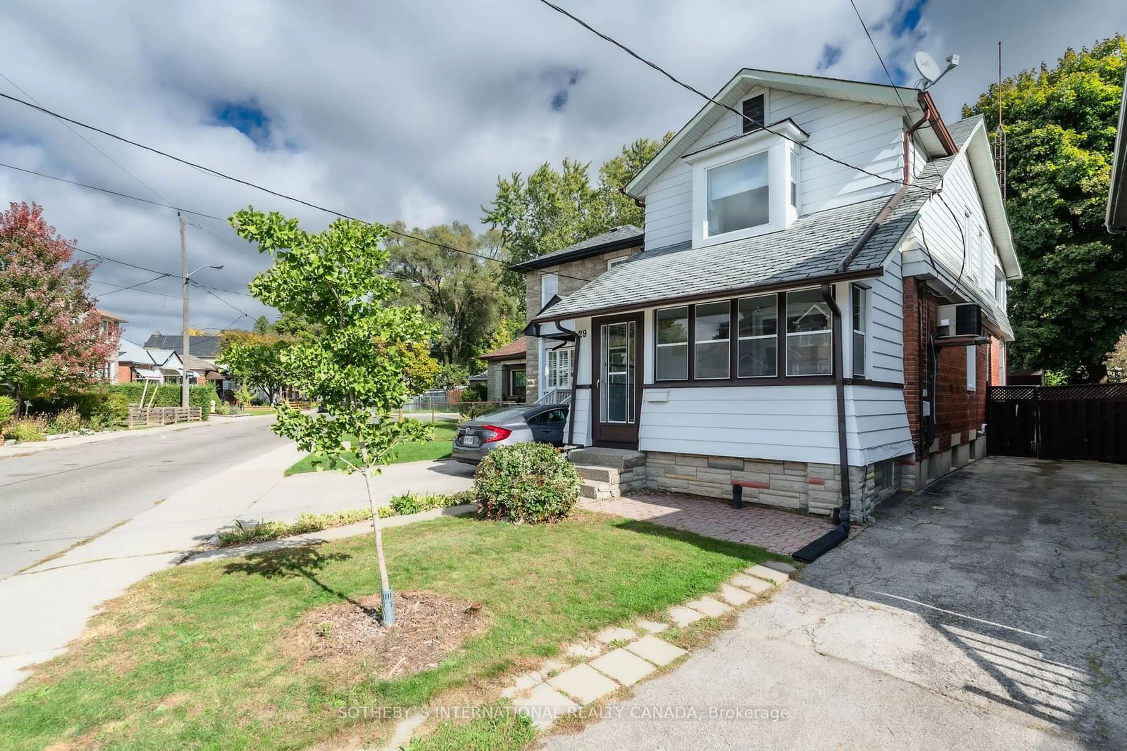 Frontside or backside of a home, the street view for 29 Florence Cres, Toronto Ontario M6N 4E6