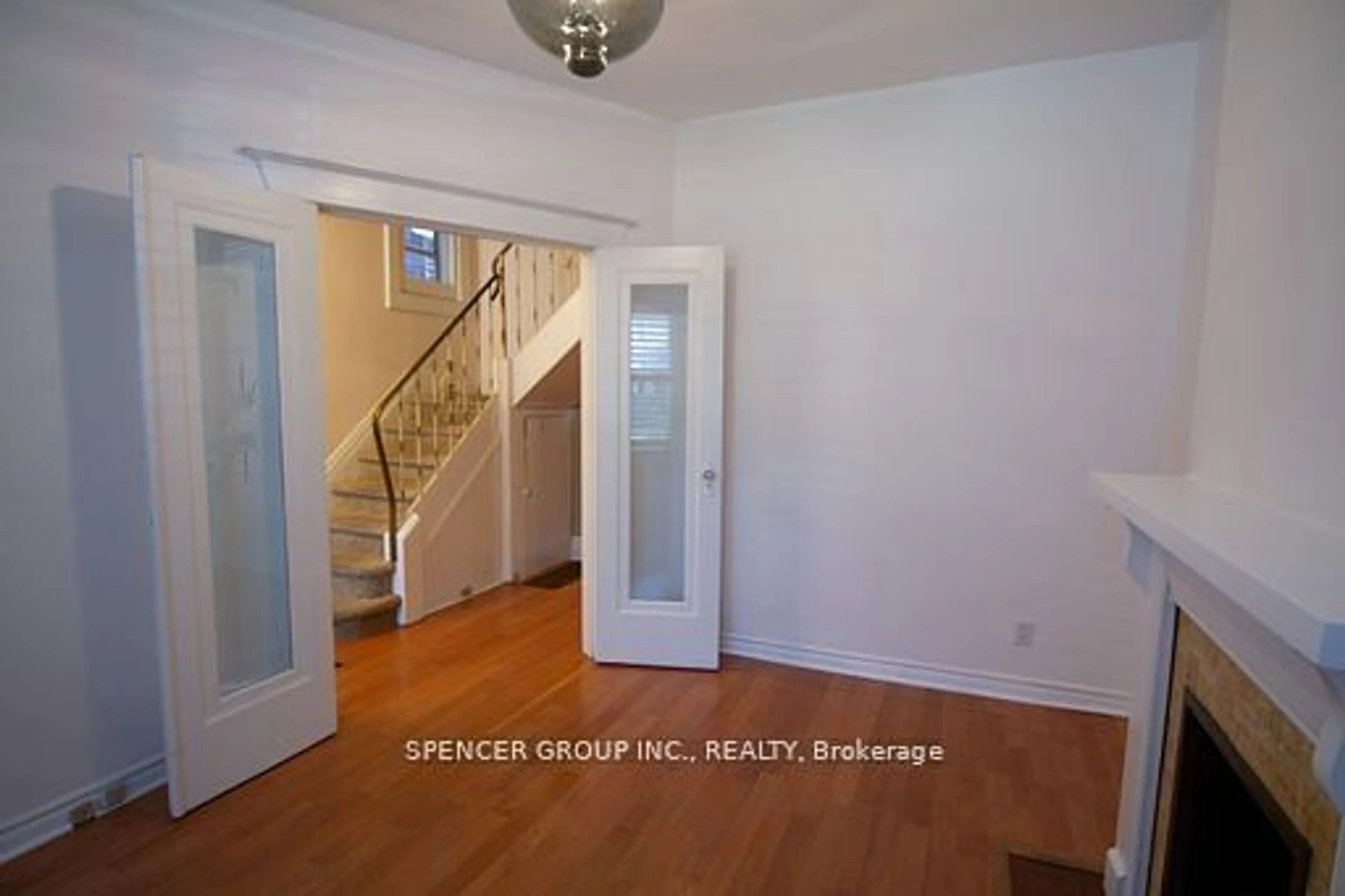 Indoor foyer, wood floors for 115 Gilmour Ave, Toronto Ontario M6P 3B2