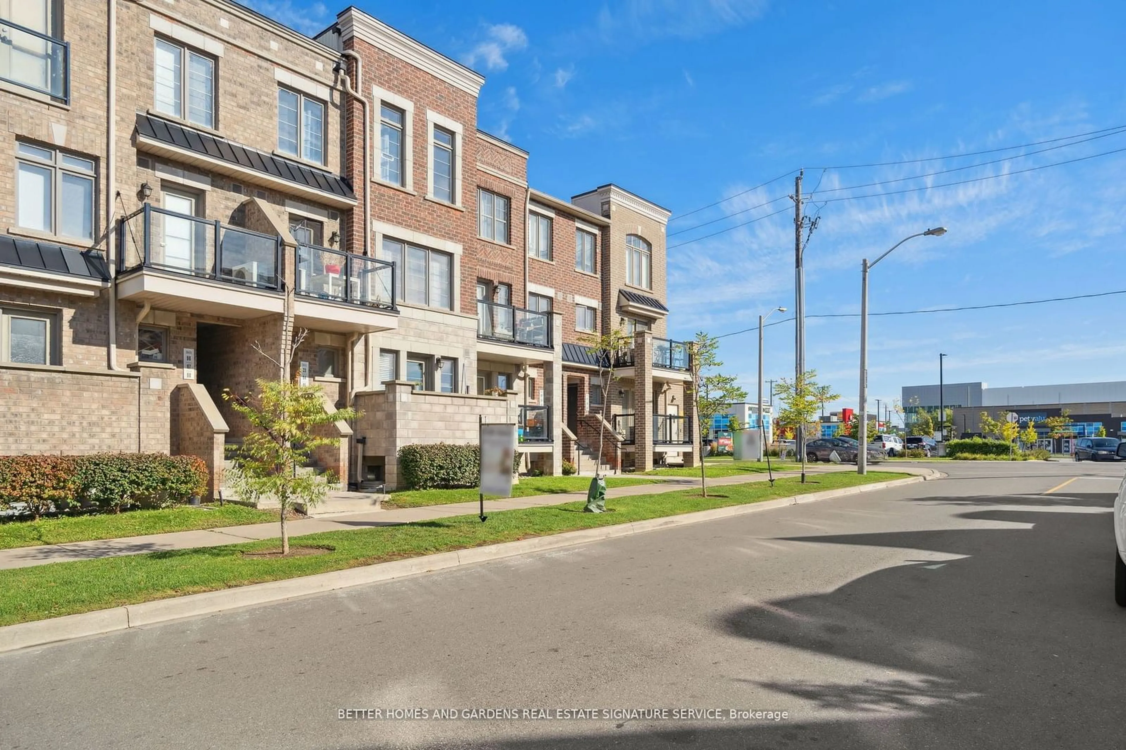 A pic from exterior of the house or condo, the street view for 100 Parrotta Dr #95, Toronto Ontario M9M 0G1