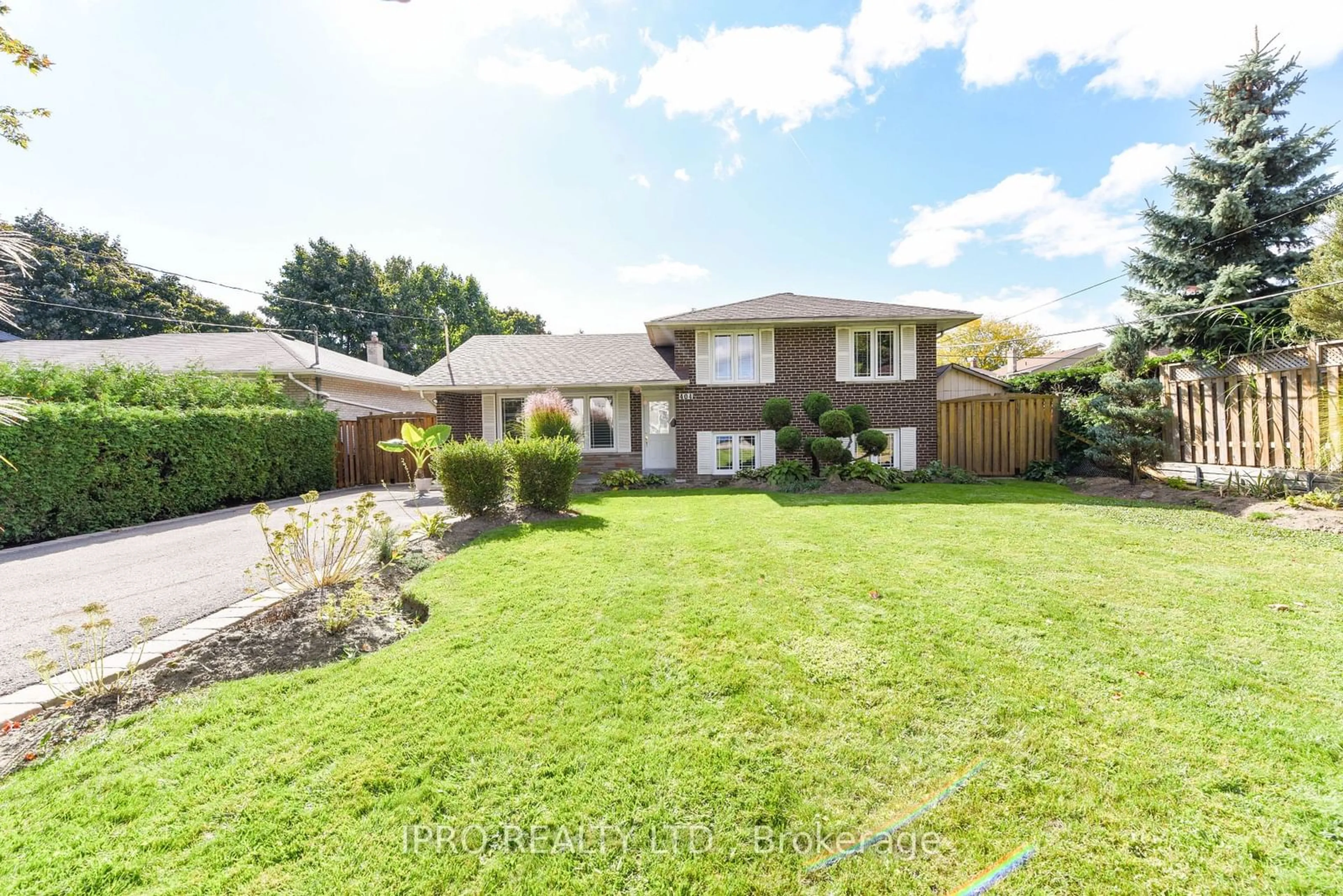 Frontside or backside of a home, the fenced backyard for 404 Claircrest Ave, Mississauga Ontario L5A 1T6