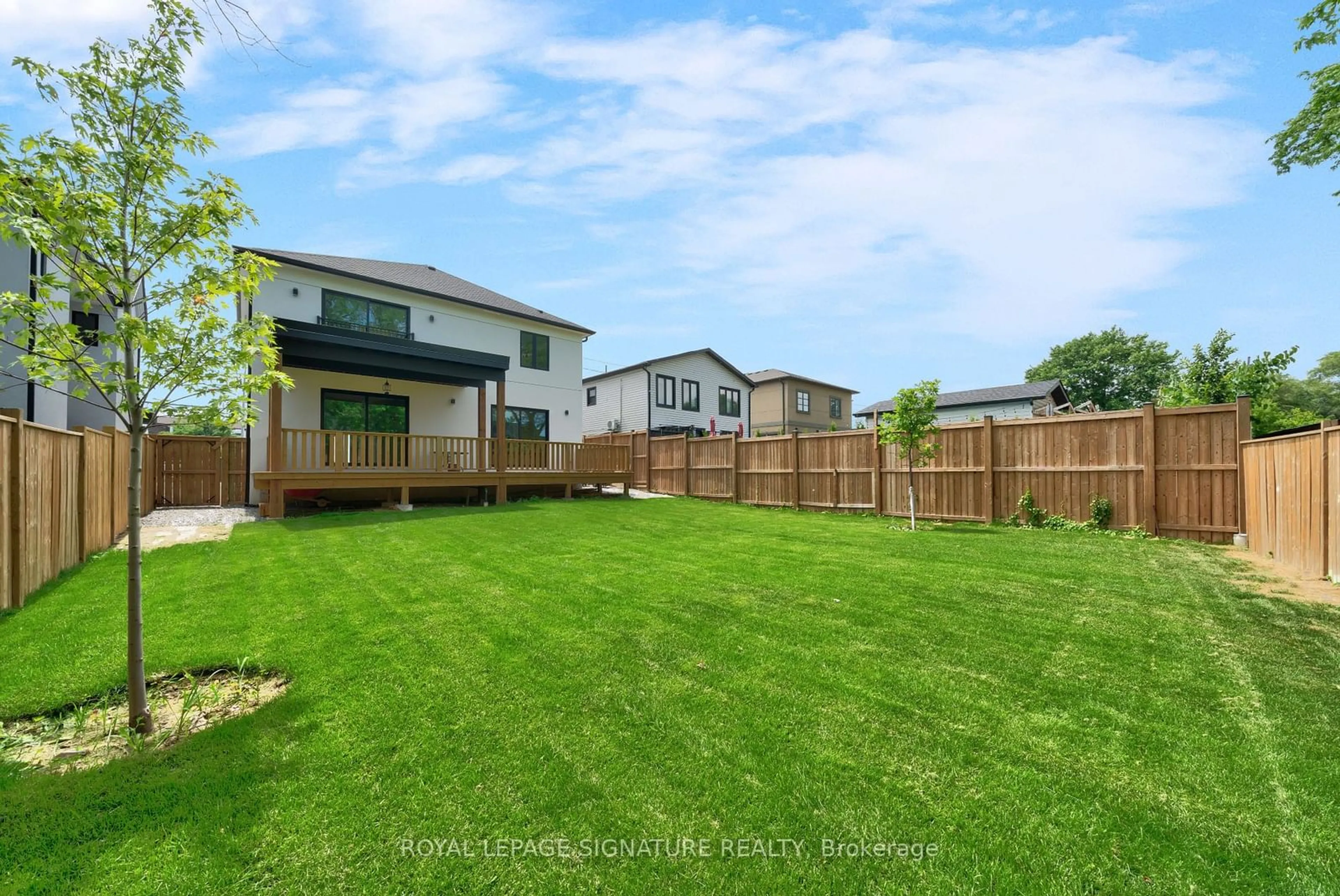 Frontside or backside of a home, the fenced backyard for 16 Walsh Ave, Toronto Ontario M9M 1B6