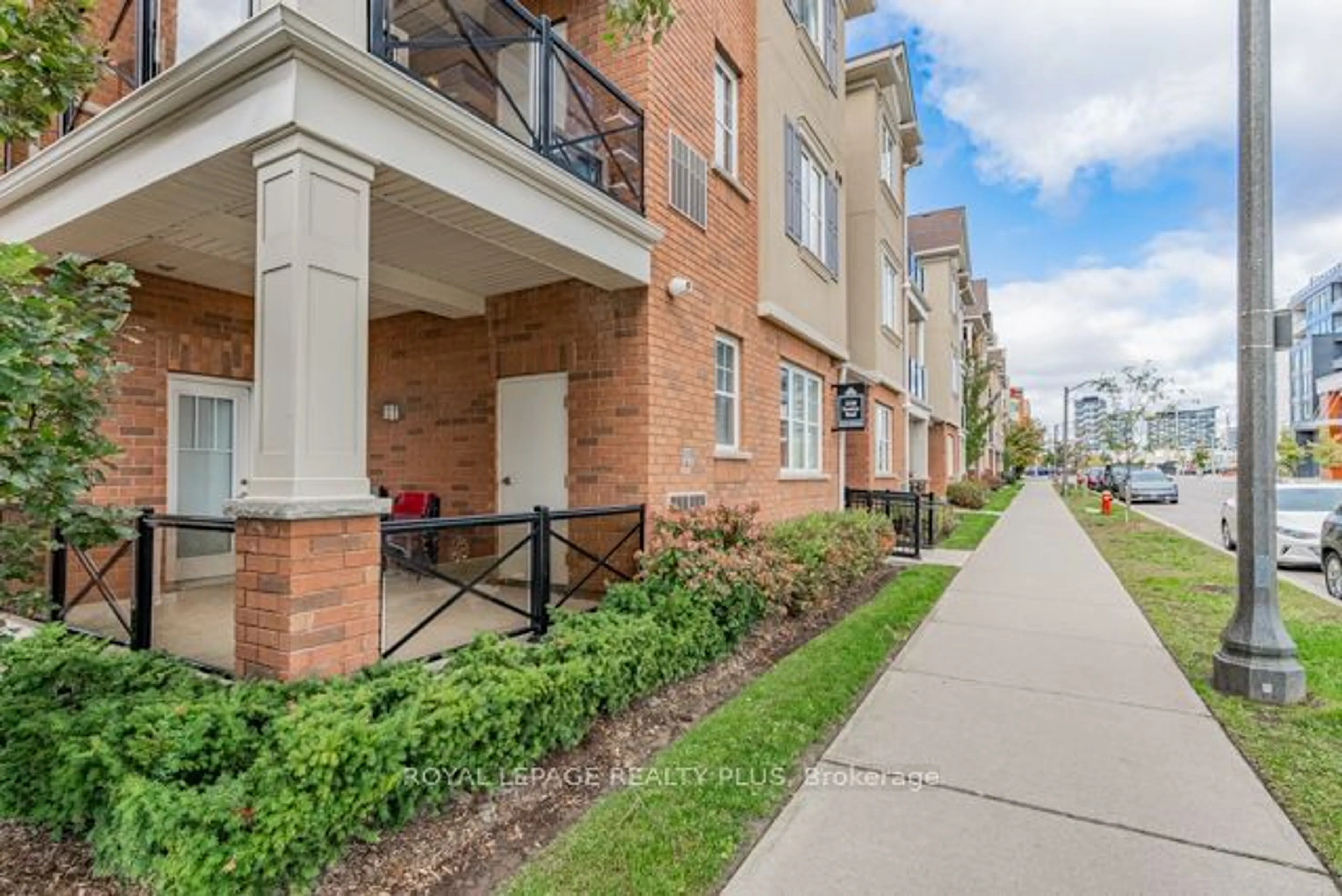 A pic from exterior of the house or condo, the street view for 2338 Taunton Rd #204, Oakville Ontario L6H 0L3